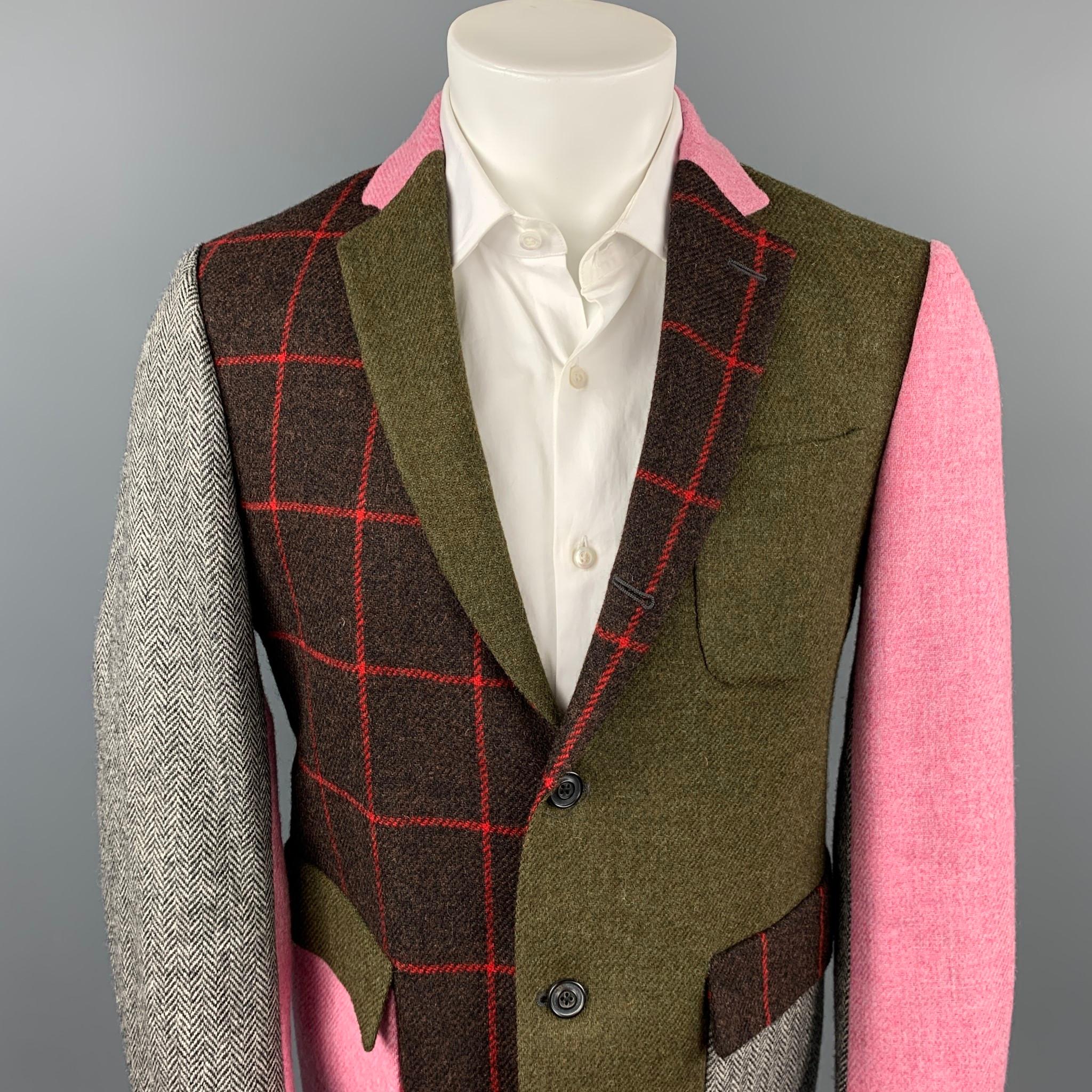 WOOSTER + LARDINI sport coat comes in a multi-color patchwork wool with a full liner featuring a notch lapel, flap pockets, and a three button closure. Made in Italy.

Excellent Pre-Owned Condition.
Marked: IT 50

Measurements:

Shoulder: 17.5