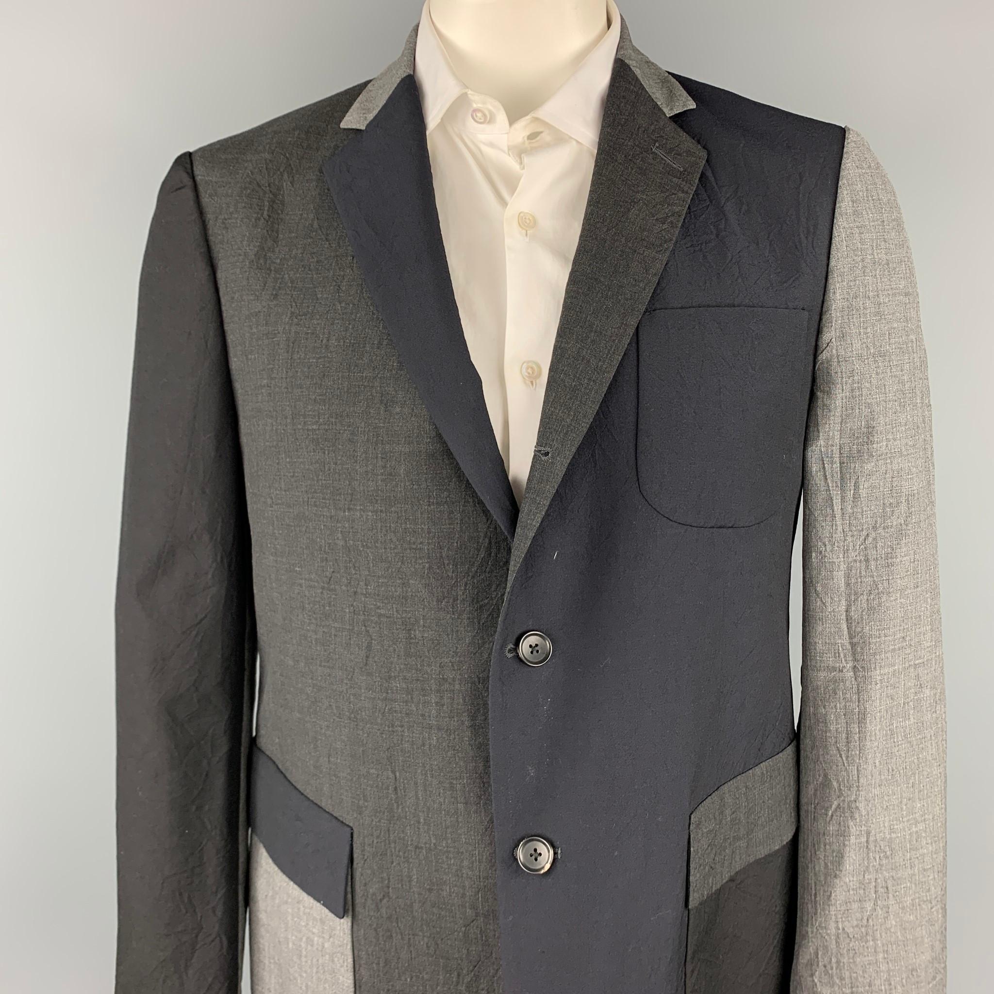 WOOSTER + LARDINI sport coat comes in a black & grey color block with a half liner featuring a notch lapel, flap pockets, and a three button closure. Made in Italy.

Very Good Pre-Owned Condition.
Marked: IT 54

Measurements:

Shoulder: 18.5
