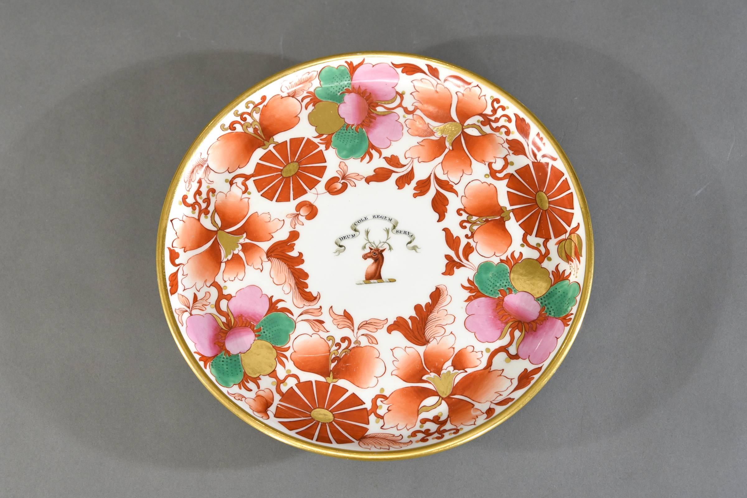 Royal porcelain works, Barr, Flight, Barr made this iconic footed cake stand with all-over Imari floral decoration. Of note is the absence of cobalt blue with the focus on greens, pink, bittersweet orange and gold. The centre features the armorial