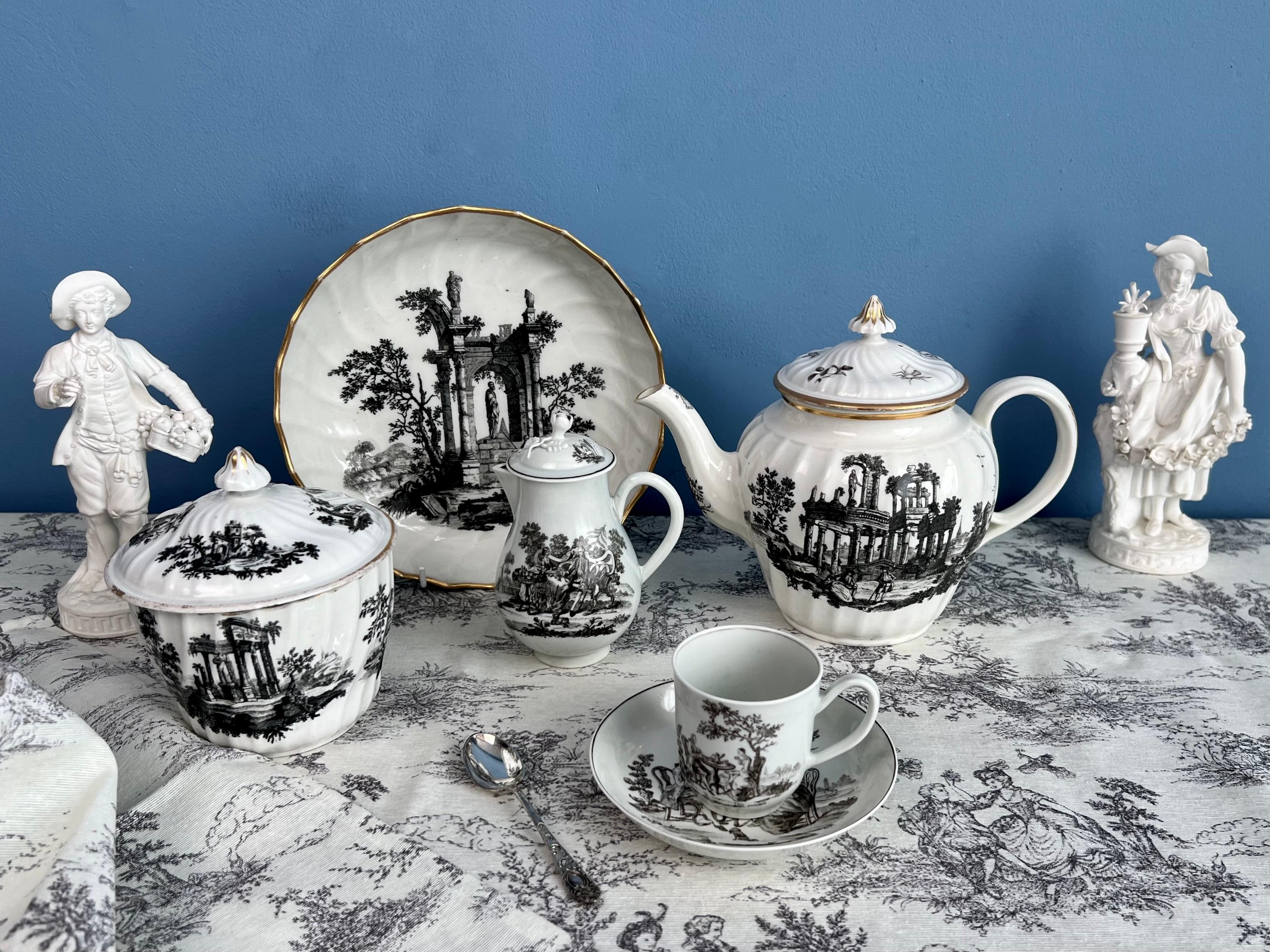 This is a very charming coffee cup and saucer made by Worcester in their First Period (sometimes called the Dr Wall Period) in about 1760. The items are decorated in a black overglaze print of a pattern called the 
