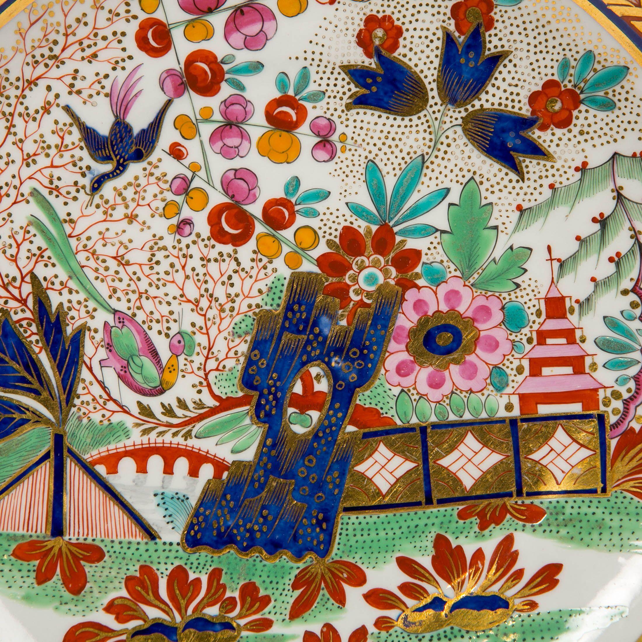 Why we love it
Fabulous colors and a dreamy design!
We are proud to offer this hand painted Barr Worcester saucer dish. The painting is an English interpretation of a Chinese landscape scene with a pagoda and flowering garden. The marvelous