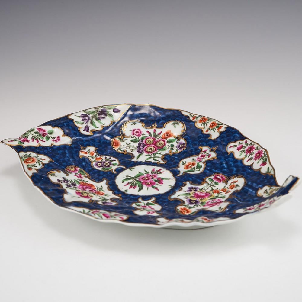 Worcester Porcelain Blue Scale Leaf Dish, c1775

Additional information:
Date : c1775
Period : George III
Marks : Blue under glaze Worcester pseudo fret square
Origin : Worcester, England
Colour : Blue scale ground with polychrome mirror and