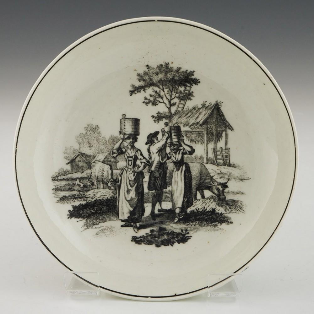 Worcester Porcelain Milkmaids Pattern Coffee Cup and Saucer, circa 1770

Additional Information:
Date: c.1765-75
Period: George III
Marks: None
Origin: Worcester, England
Colour: Black and white
Pattern: Transfer printed in the milkmaid