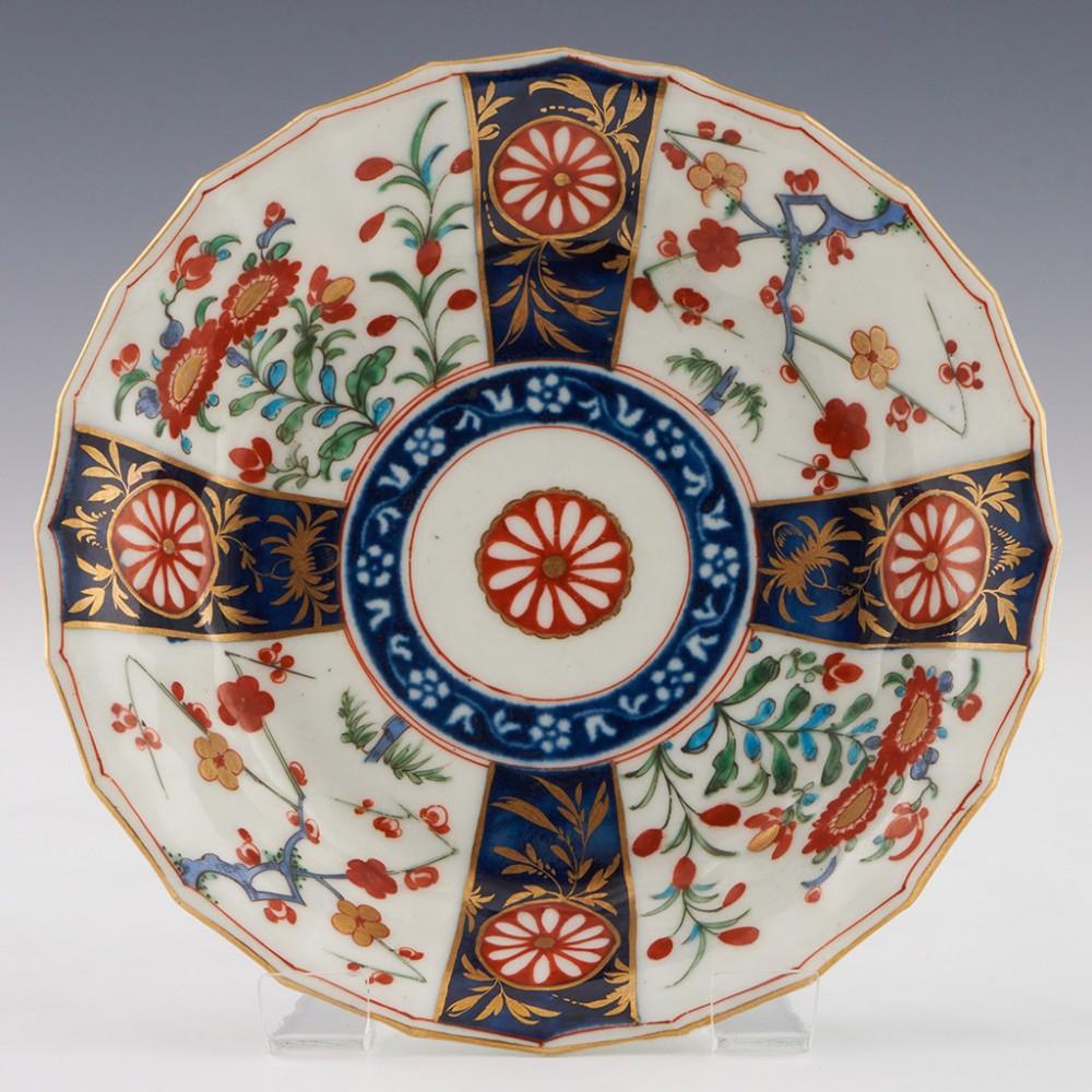 Heading :  Worcester porcelain Queen's pattern coffee cup and saucer
Date : c1775
Period : George II
Marks :Pseudo fret square
Origin : Worcester, England
Colour : Polychrome
Pattern : Queen's - imari palette panels

Features:Fluted
Condition