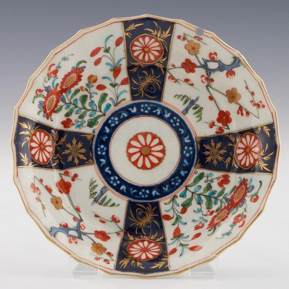 Heading :  Worcester porcelain Queen's pattern coffee cup and saucer
Date : c1775
Period : George II
Marks :Pseudo fret square
Origin : Worcester, England
Colour : Polychrome
Pattern : Queen's - imari palette panels

Features:Fluted
Condition