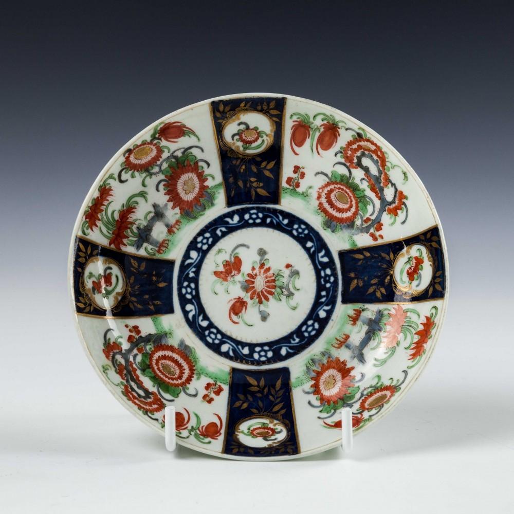 Heading : Worcester Queens pattern tea cup and saucer
Date : 1768-1774
Period : George III
Marks : Worcester painted blue square fret mark
Origin : Worcester, England
Colour : Kakiemon palette
Pattern : Queens pattern
Features : A cup and