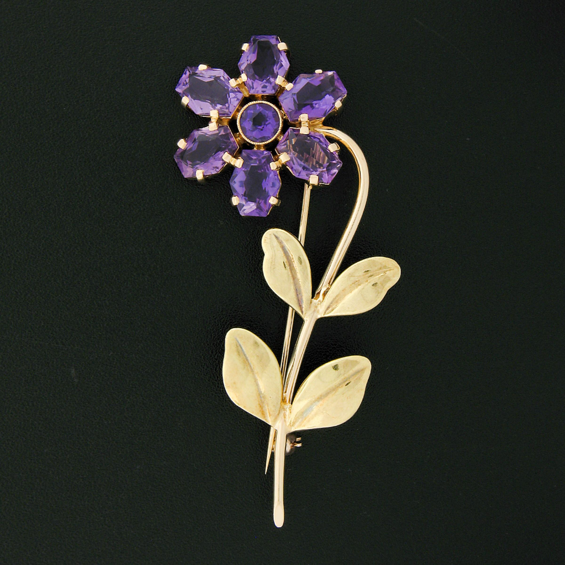 Here we have a large vintage, Allsopp-Bliss Co., brooch that was crafted from solid 14k gold. It features a beautiful flower design that is neatly set with fine amethyst stones as the petals. A round brilliant cut amethyst is milgrain bezel set at