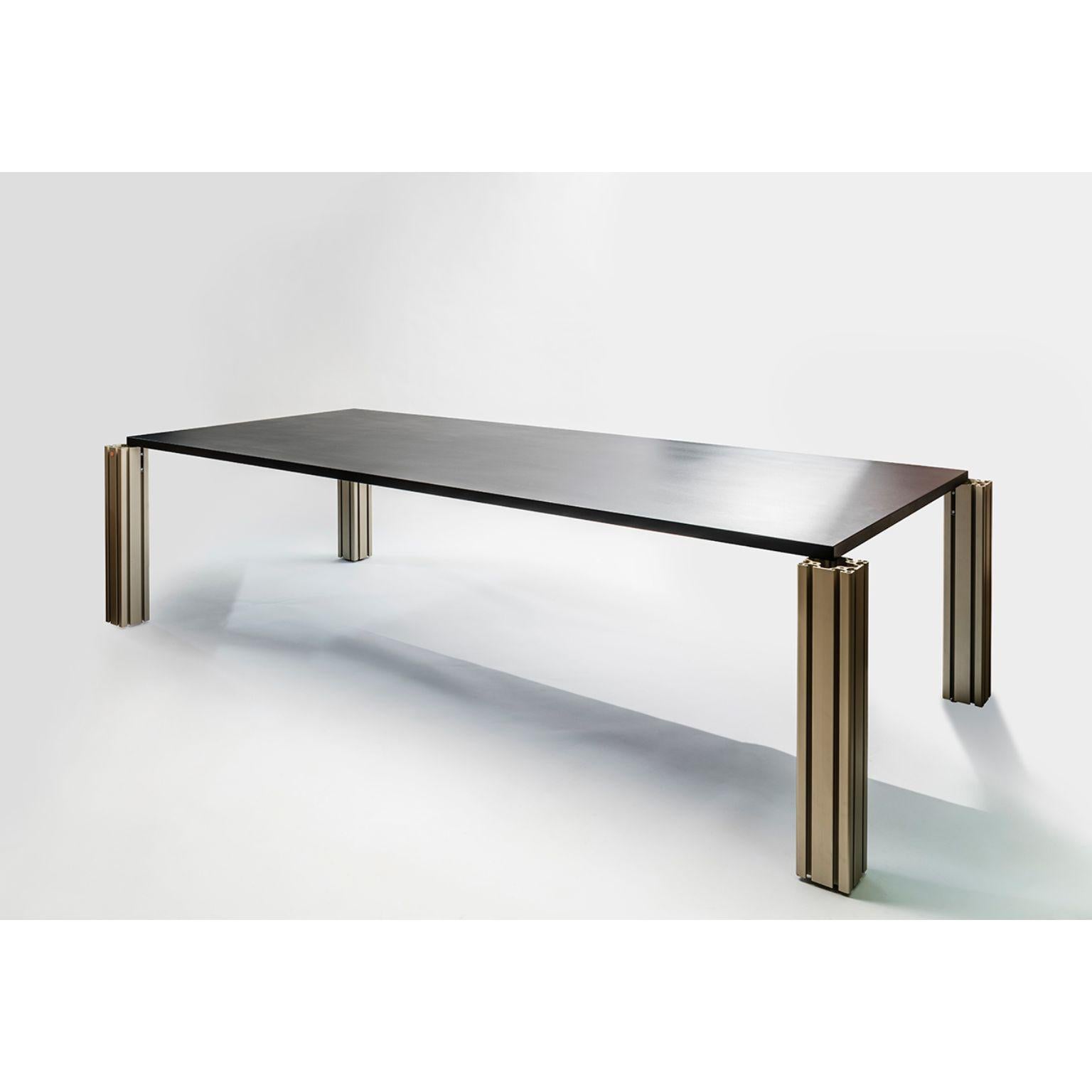 Work extruded table by Ben Gorham.
Materials: Top: Antracite/Nero Ferro/Nero Rt 9822/ Peltro metal and Concrete
 Structure: Champagne extruded anodized aluminium
Dimensions: W 292 x D 132 x H 72.2 cm

  

Work Extruded is a table whose design