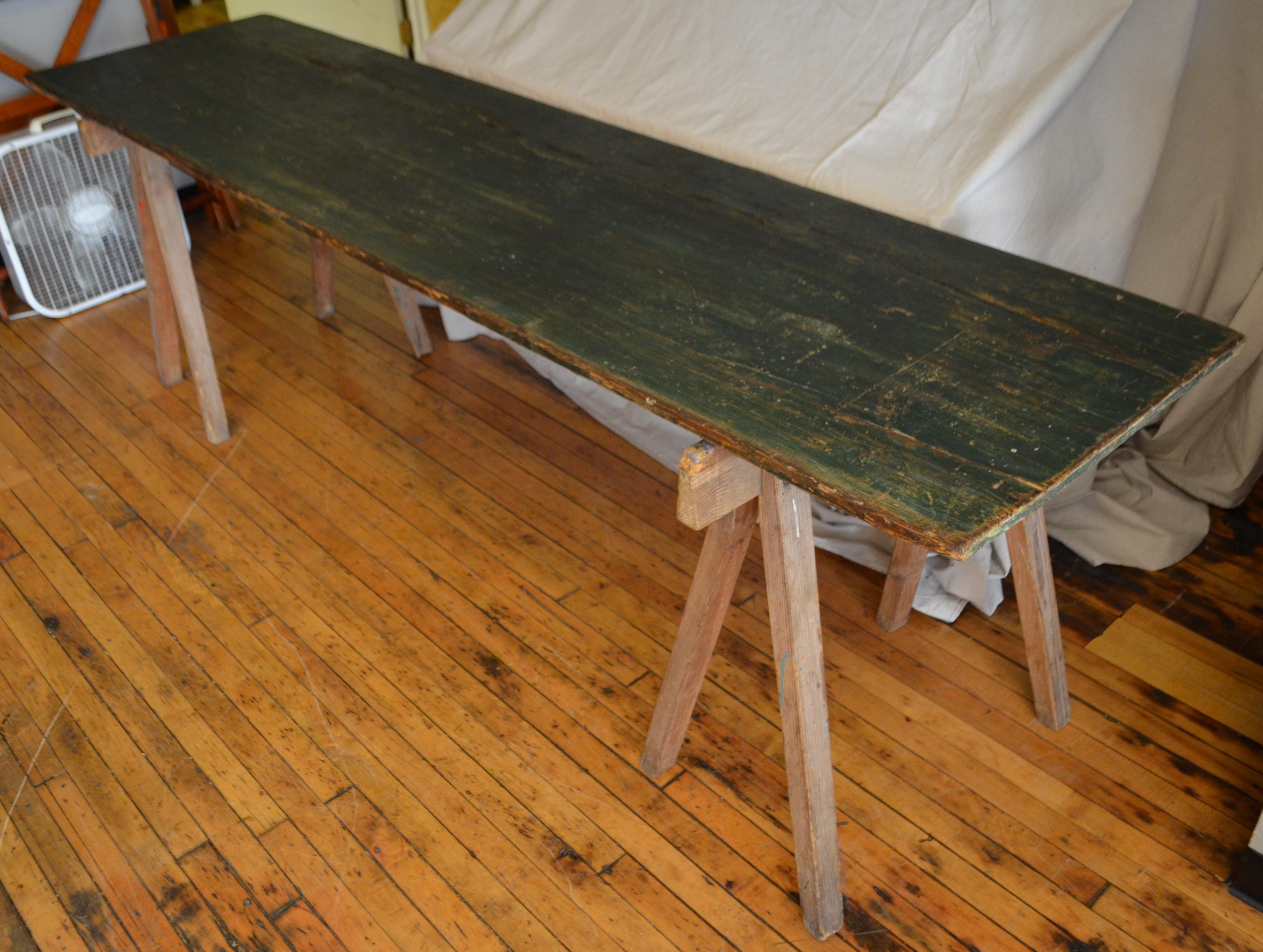 Harvest, work table from France on sawhorse legs. Beautifully Primitive with a rich, painterly patina. Travels light with two sawhorses and easily managed top. For beach house with parties on the sand. For the deck of forested cabin with parties