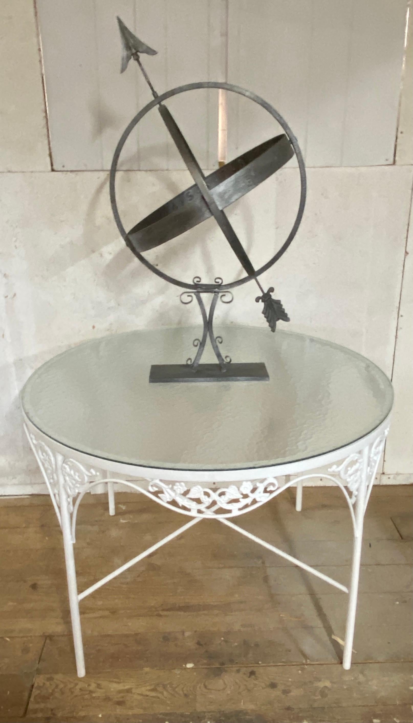 A vintage Swedish armillary sundial, accented with numeric banding around the sphere's center perimeter can be placed on plinth or a table to make a striking addition to any garden landscape or in a room. The sundial has a silver antiqued