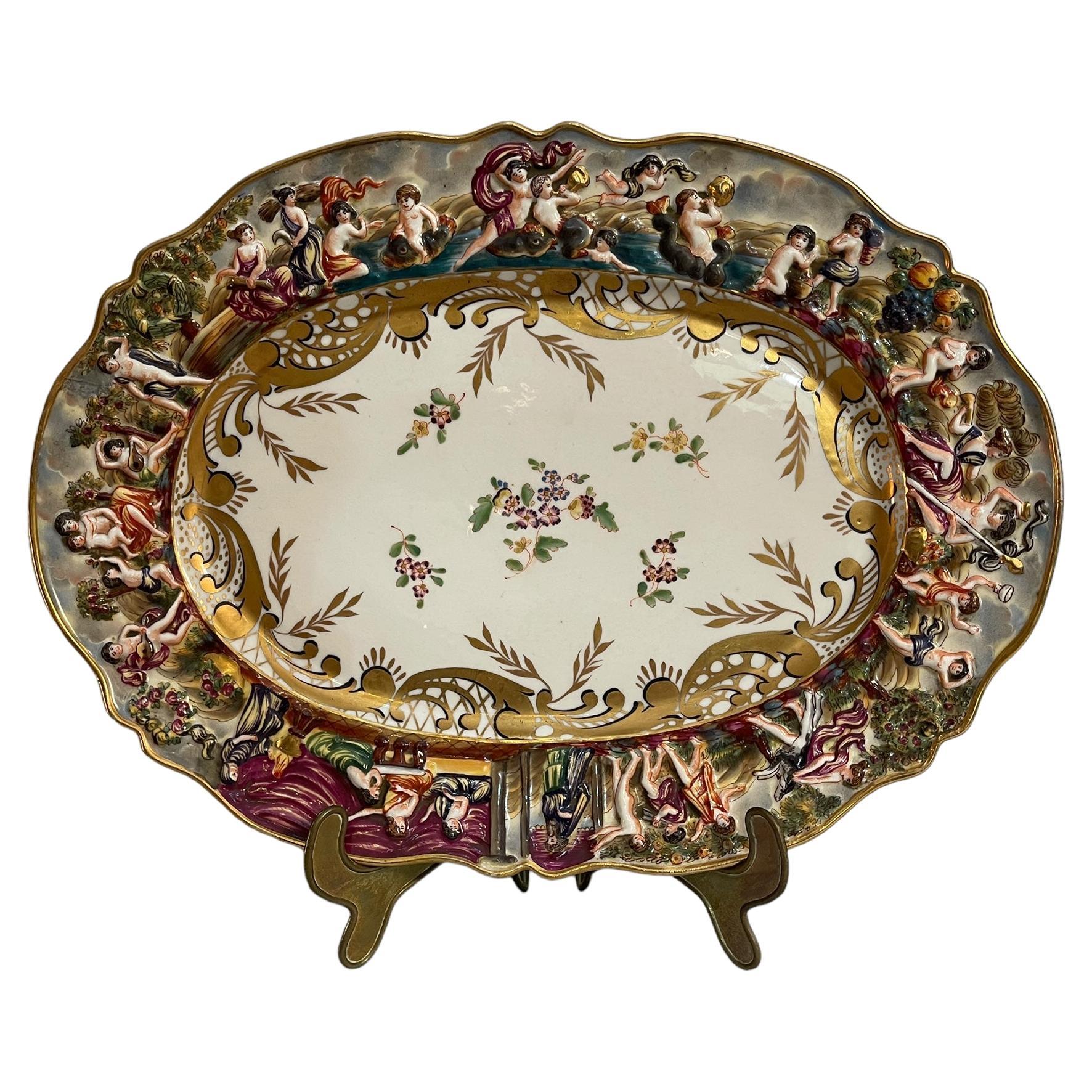Worked and decorated ceramic plate, Capodimonte, 19th-20th century For Sale