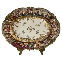 Worked and decorated ceramic plate, Capodimonte, 19th-20th century