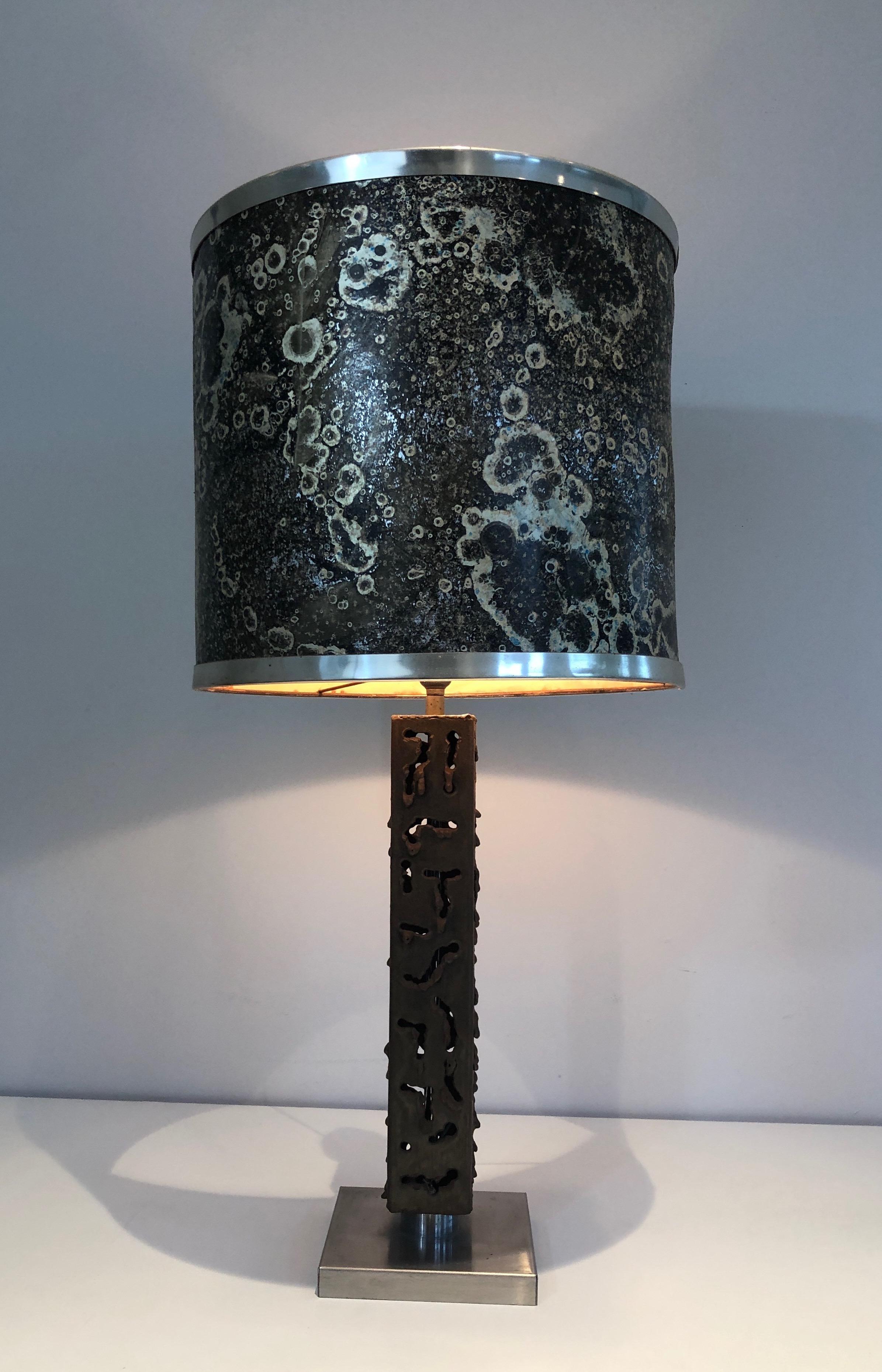 This table lamp is made of a worked steel. This is a French work. Circa 1970.