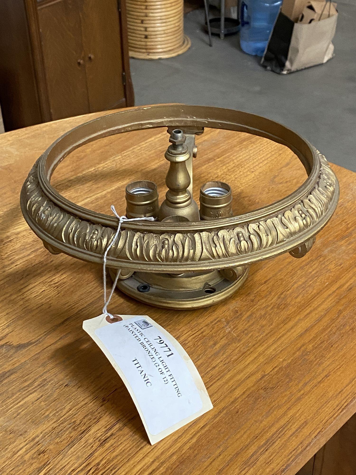 Screen Used Ceiling Light Prop From 1997 Titanic made of plastic and metal with original auction tag and COA from 20th Century Props.

MARCSS