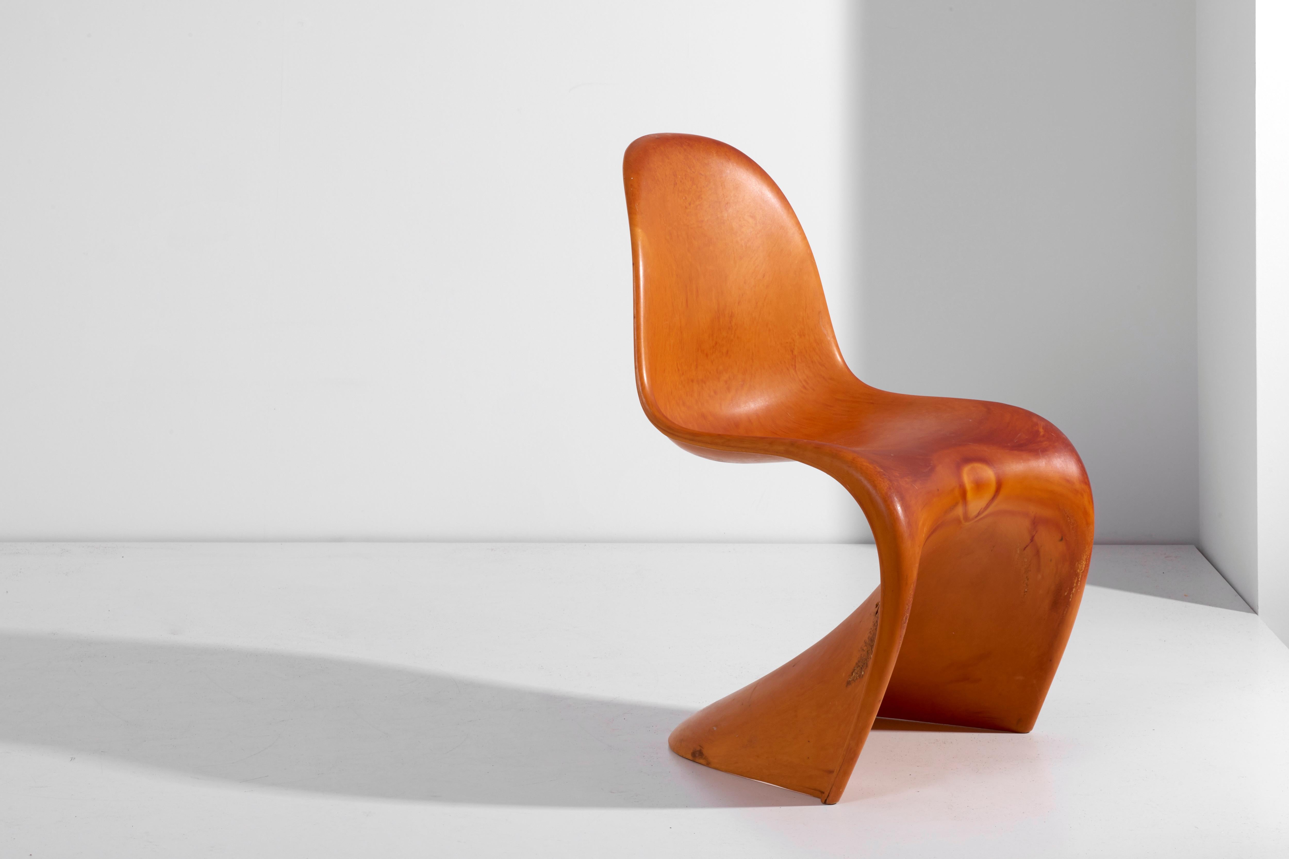 Workpiece of the famous Panton chair. Designed by Verner Panton and produced circa 1968 by Vitra Design in Germany. Made of orange/brown polyurethane foam (Baydur, Duroplast), structured and not lacquered.

Blank from the test phase prior to
