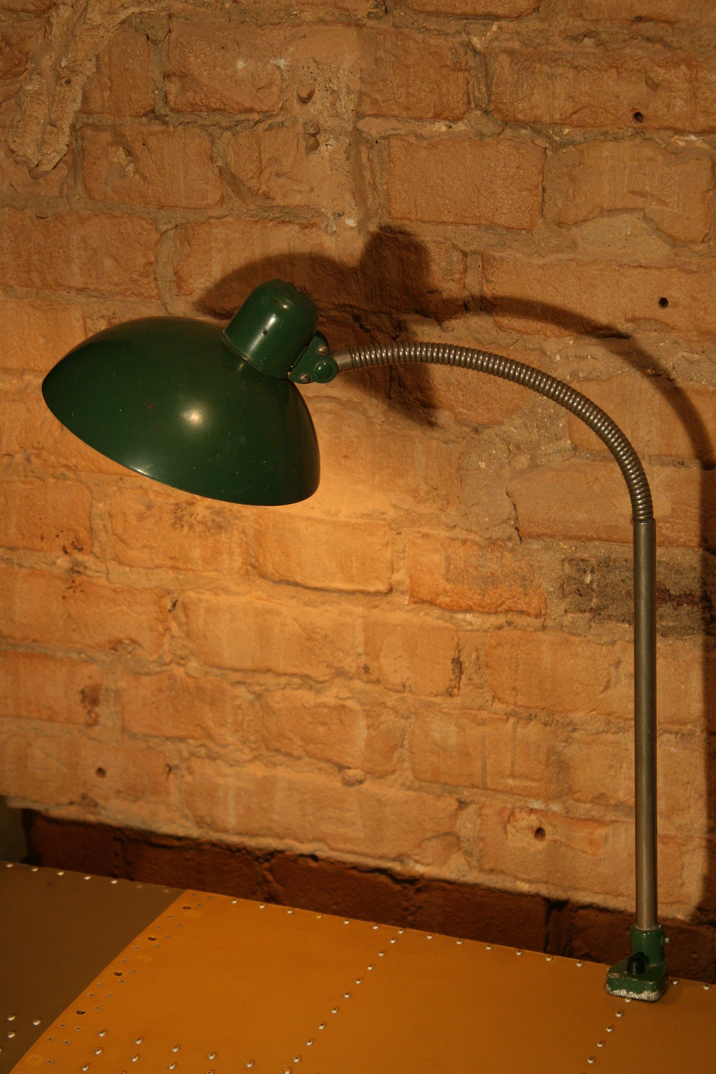 The original Kaiser lamp type 8740 was designed in 1933 by Bauhaus master Christian Della. It is a classic example of industrial design from the 1930s.
The offered lamp is a rare version in the original green finish.
Producer: Gebruder Kaiser &
