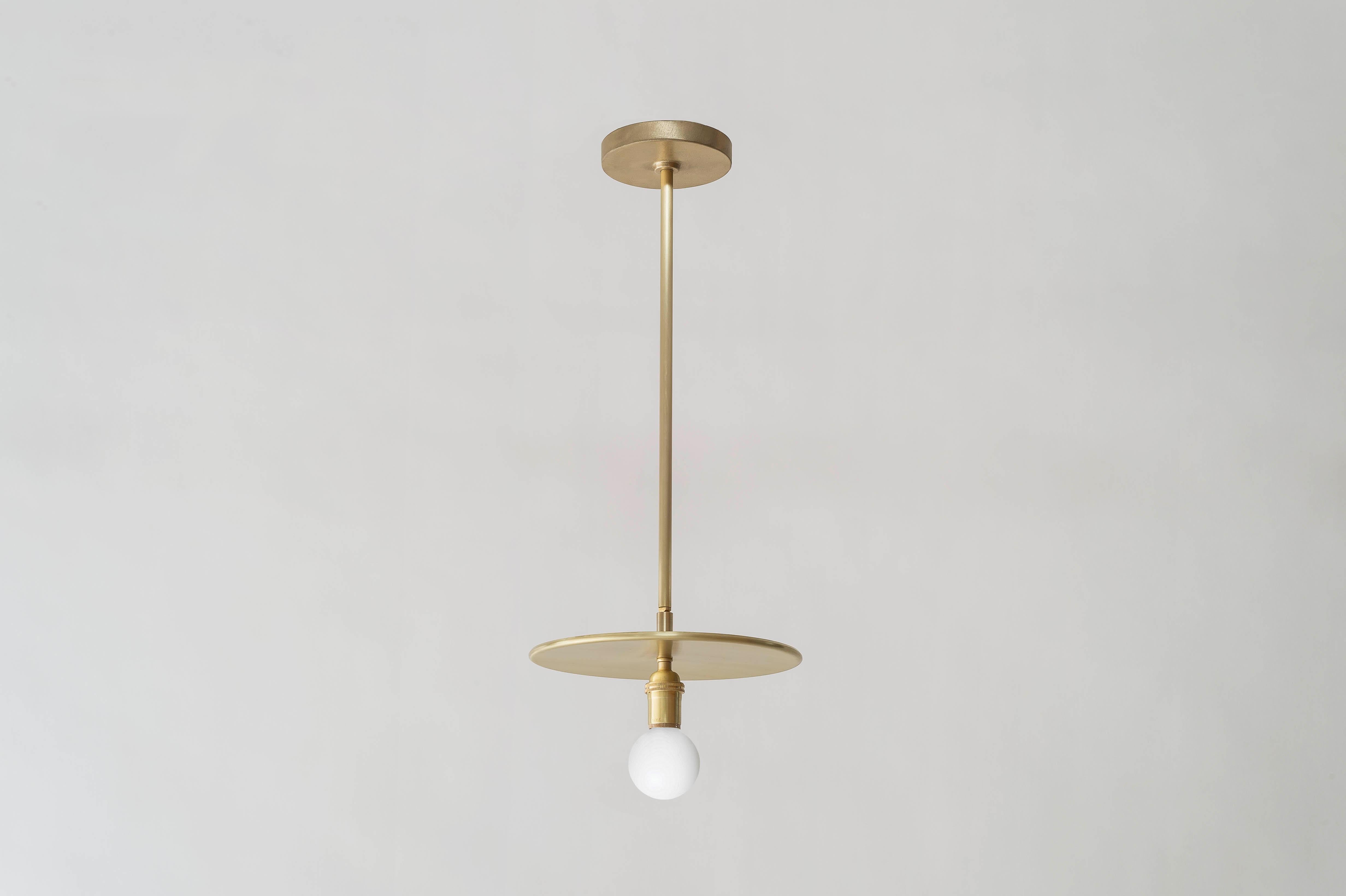 This elemental pendant comes in a hewn brass finish. A pivot joint allows for 90 degrees of rotation. The dimension of the rod can be customized at three standard lengths (24