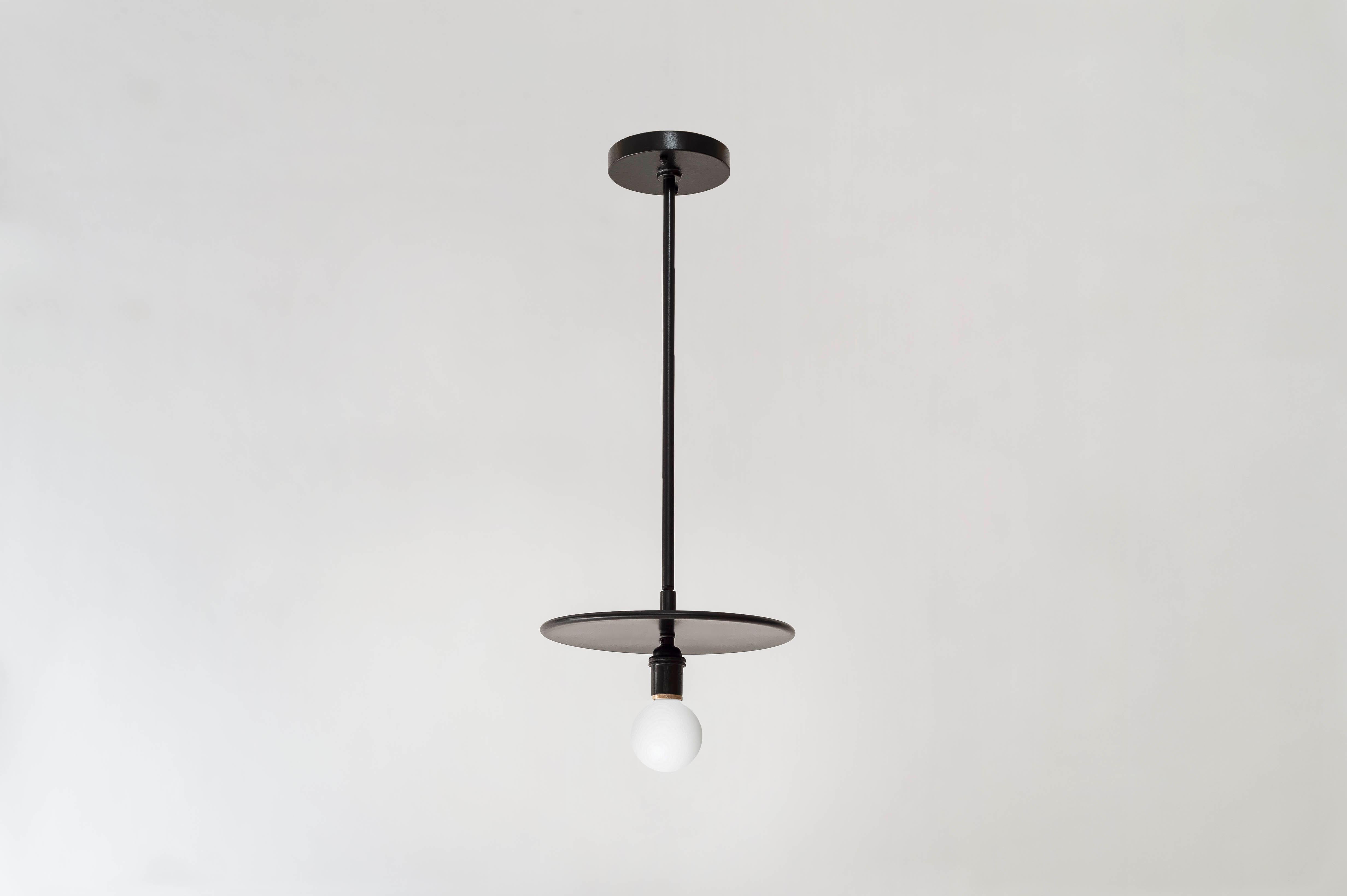 This elemental pendant comes in an all-black finish. A pivot joint allows for 90 degrees of rotation. The dimension of the rod can be customized at three standard lengths (24