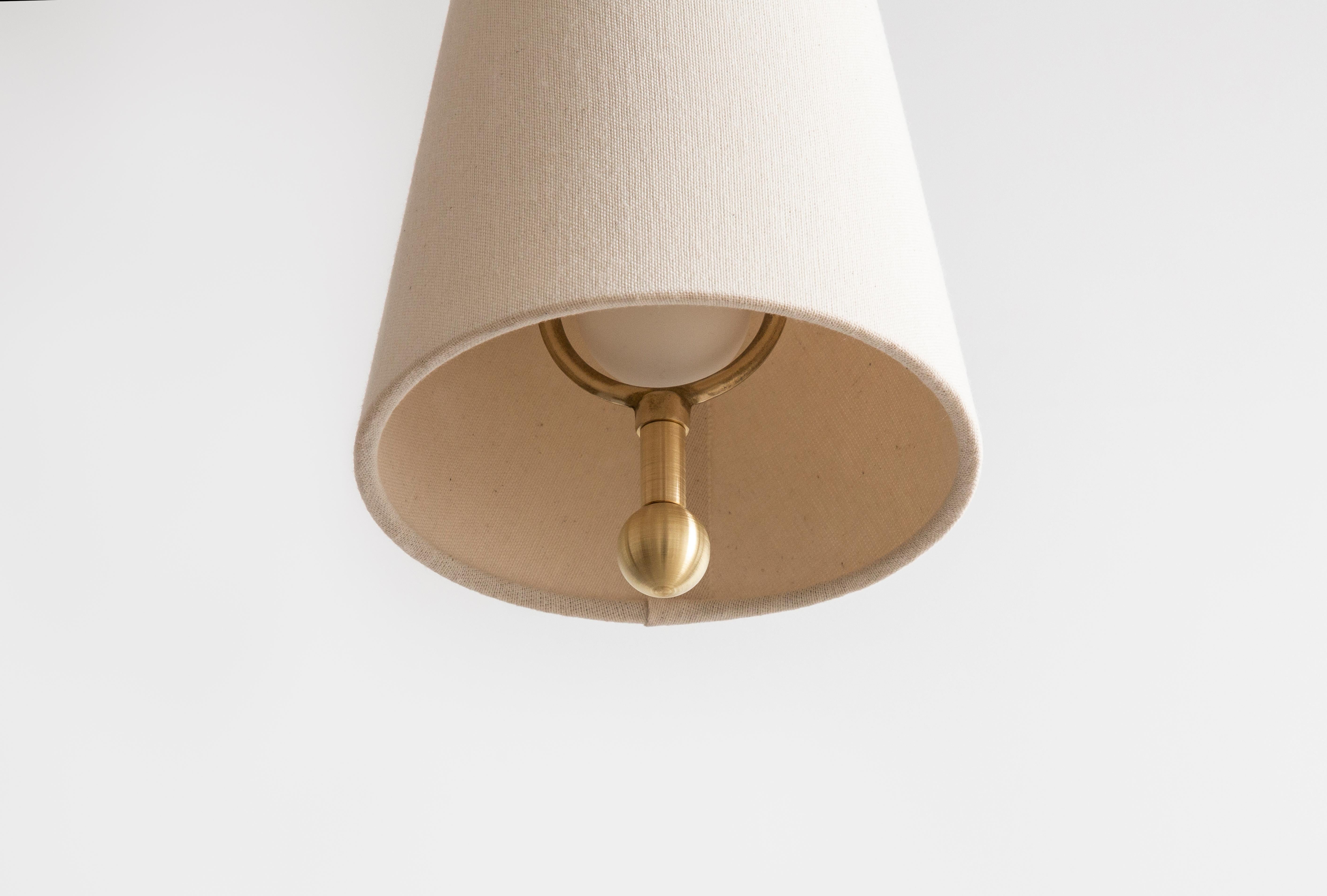 The house cord pendant small is a diminutive take on a Classic shaded pendant form. Perfectly scaled to make a subtle yet impactful statement, the pendant combines a modern drop-cord function with this iconic traditional form. Incorporating a