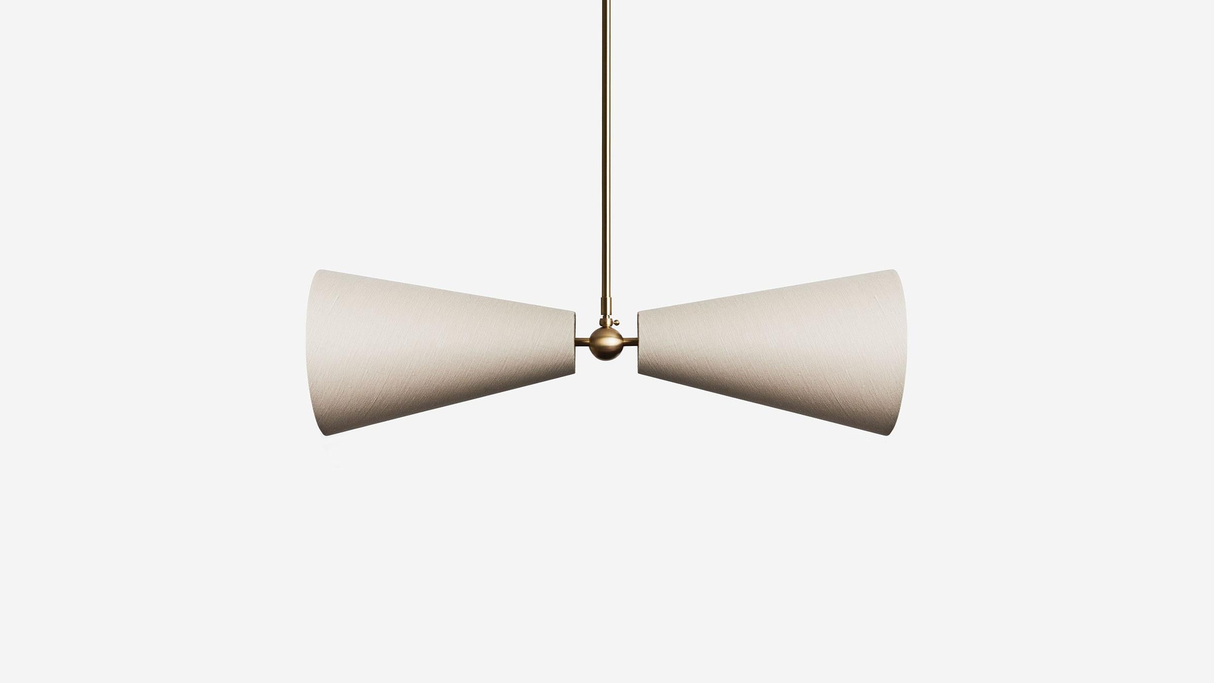 Pendolo Pendant II explores two opposing cone forms, and the latent tension between gravity and levity within their arrangement. Configured as a horizontal or near-vertical fixture, this pendant variation can occupy both a wide or narrow footprint.