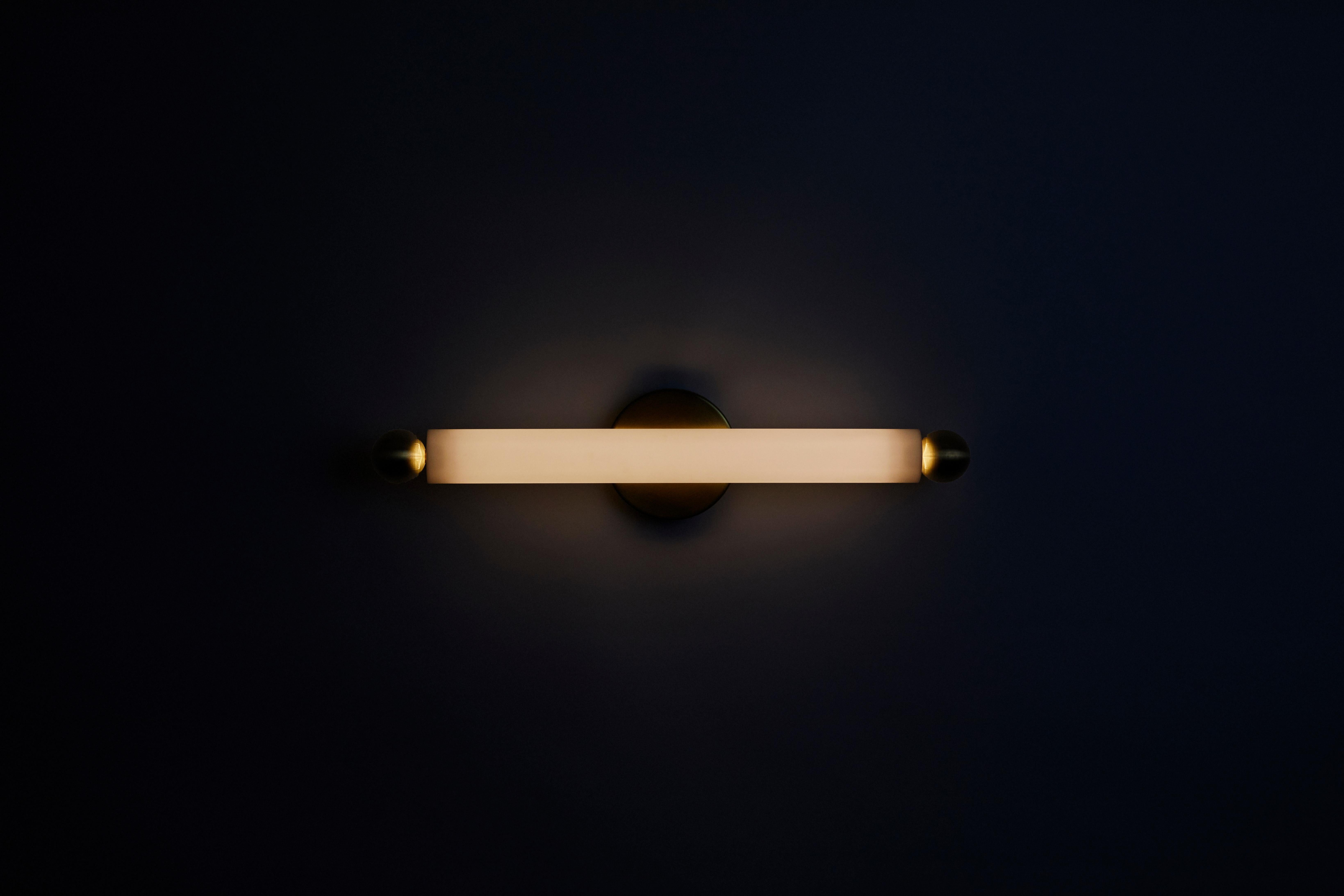 The TUBE SCONCE / FLUSH MOUNT MEDIUM is a versatile slim sconce, our take on a classic vanity fixture. Mounted either vertically, horizontally, or flush mount, the fixture expresses a bold beam of light appropriate for bathroom and hallway