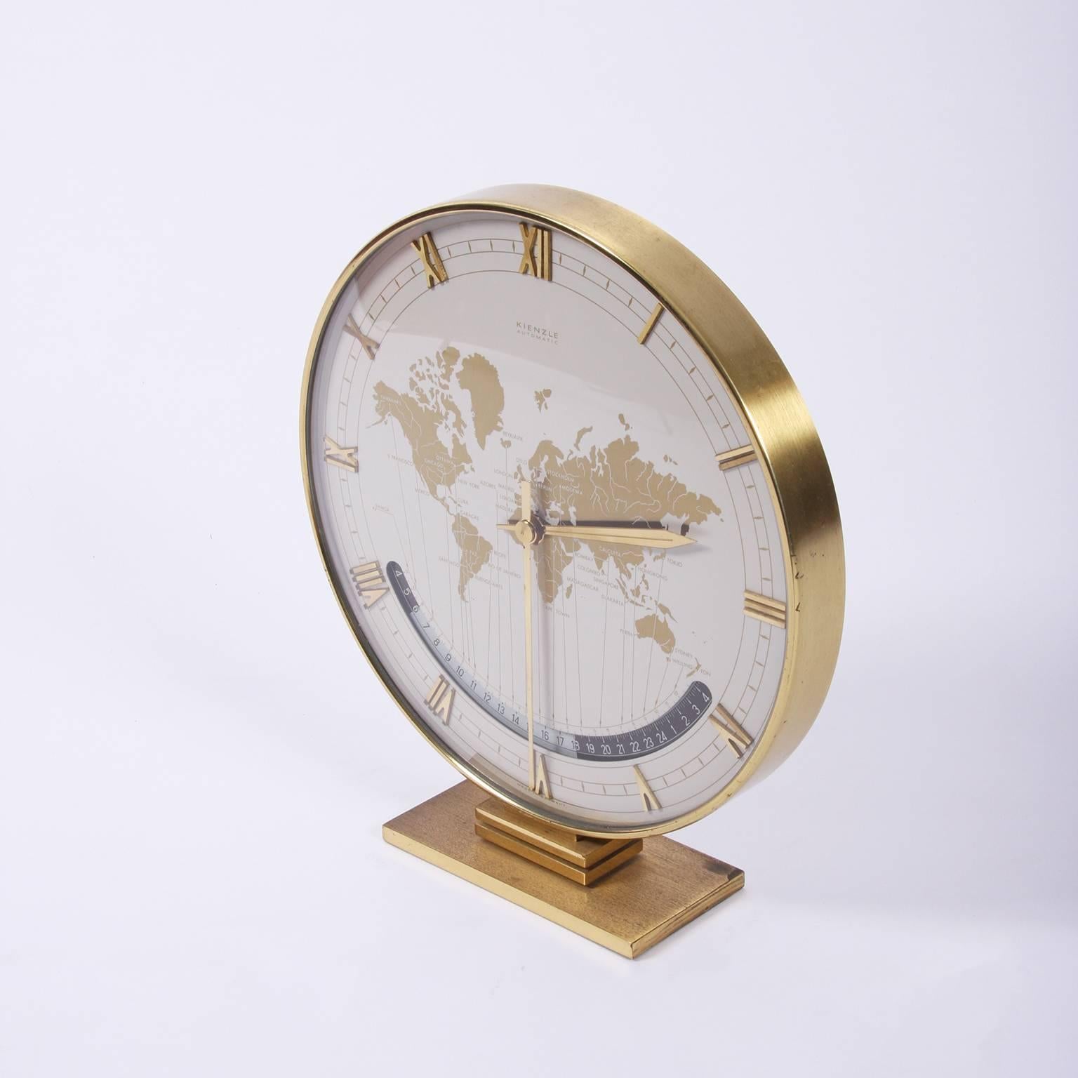 German, circa 1960.

An electric world clock, made by Kienzle with a brass case. Displays the time throughout the world.