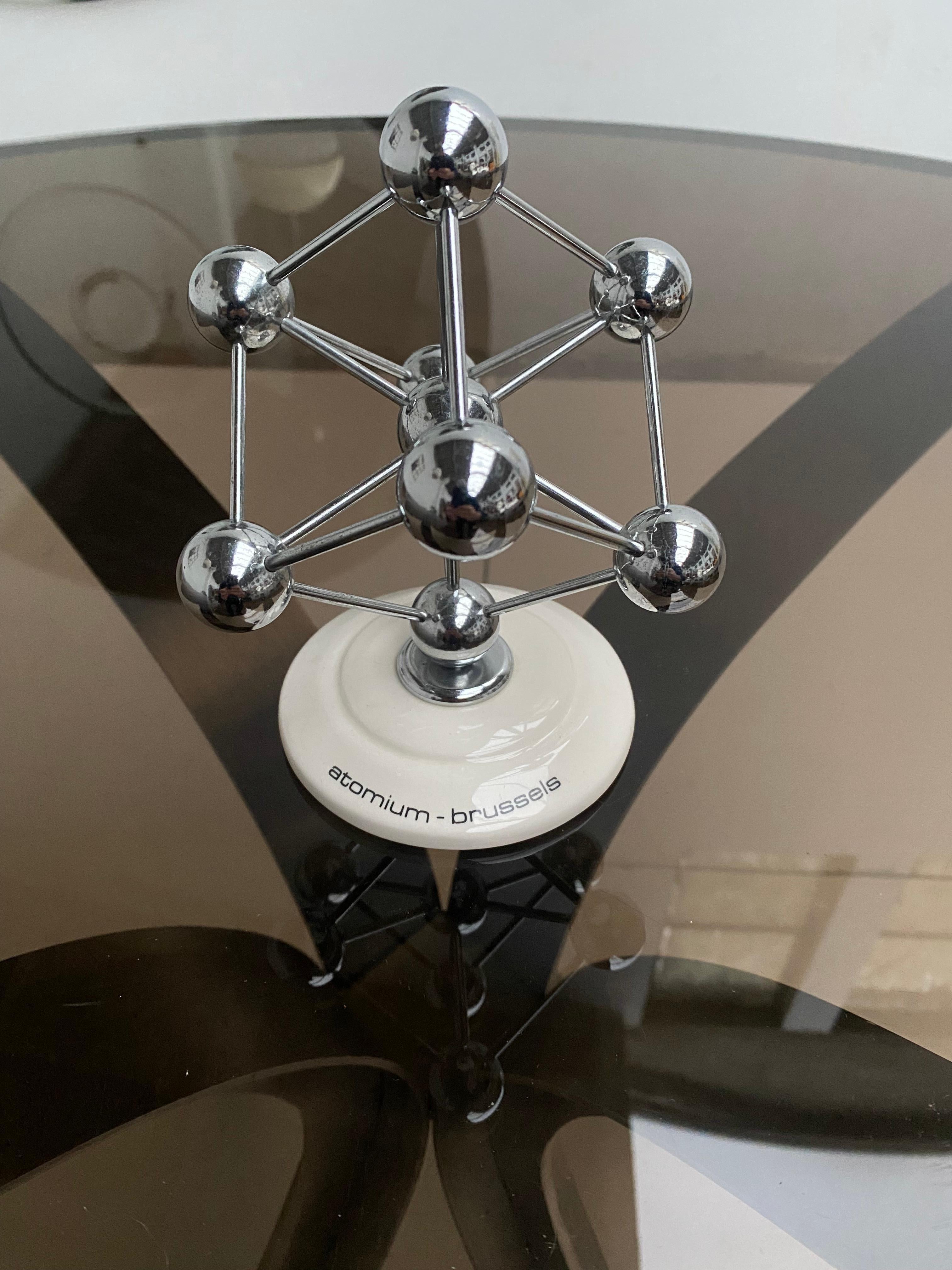 A lovely desk decoration from Brussels Belgium

The Atomium was built as the main pavilion and icon of the 1958 World's Fair of Brussels (Expo 58)
Faith in scientific progress was great, and a structure depicting atoms was chosen to embody this

The