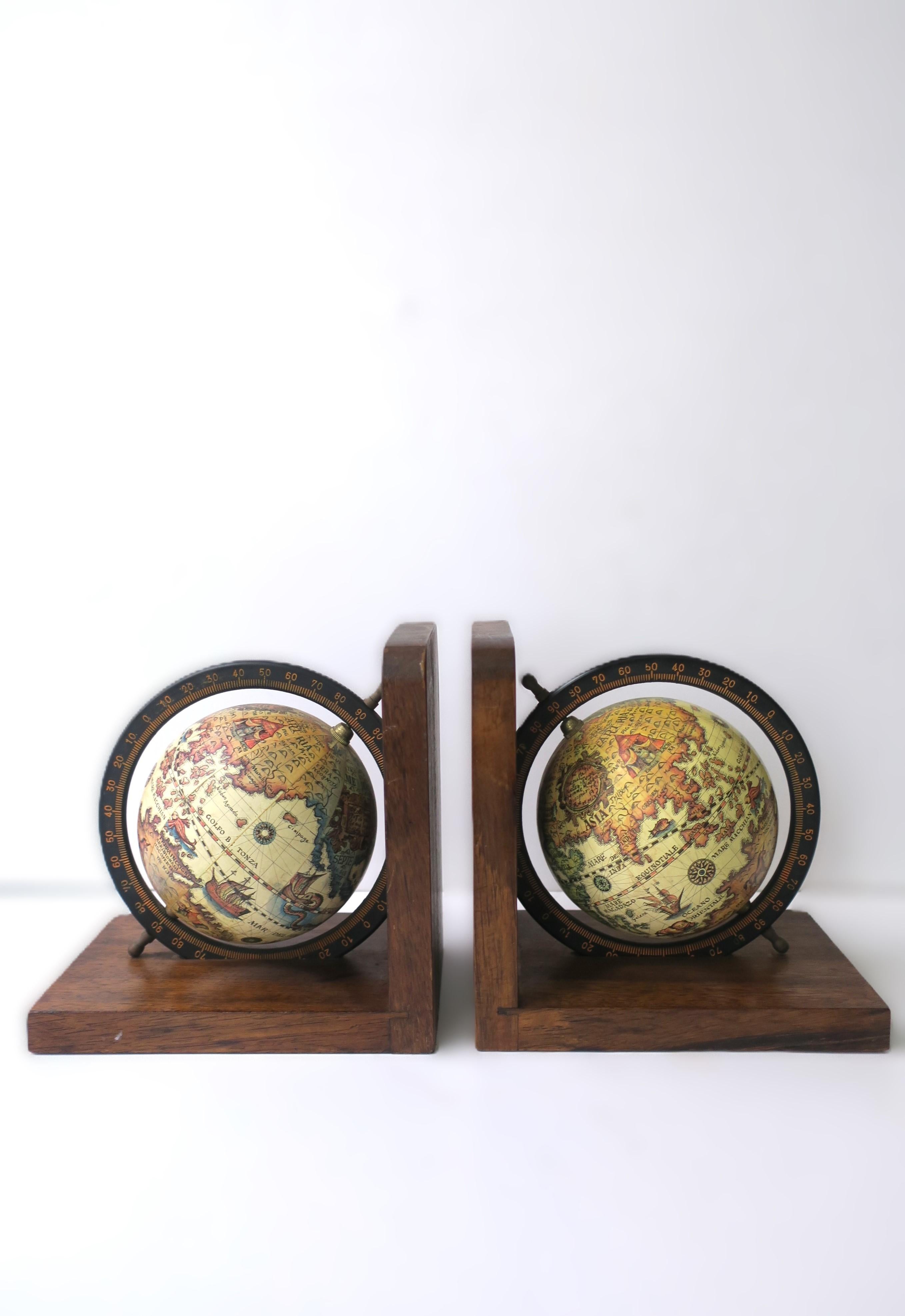 A well-made pair of world globe bookends with metal and brass accents, circa mid-20th century, Japan. Globes spin 360 degrees. A great pair for an office, library, living room, etc. Marked 'Made in Japan' on underside of both as shown in last two