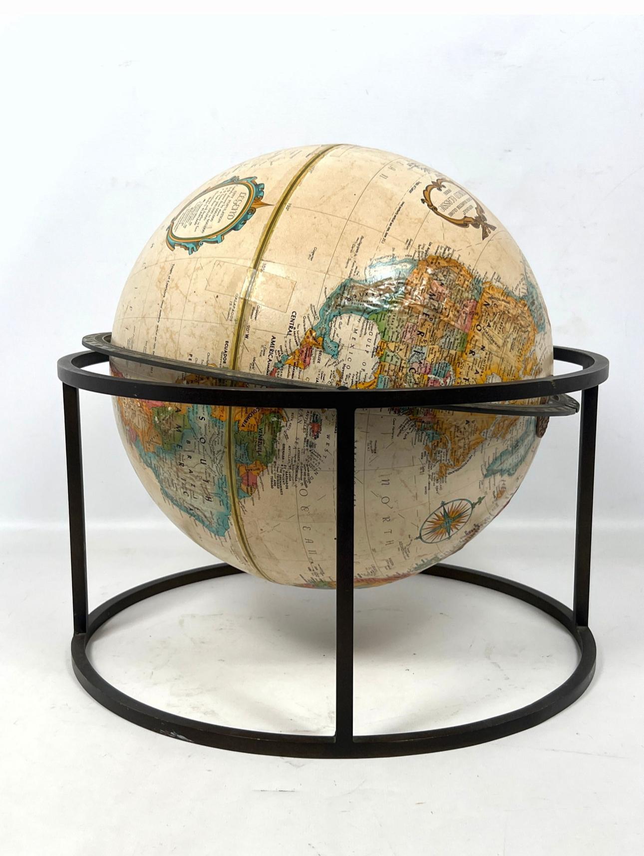 World tabletop globe by Replogle in the style of Paul McCobb.

 USA, circa 1970. Signed.

Beige globe supported by swivel stand in dark finish. Featuring square tube design made popular by McCobb.