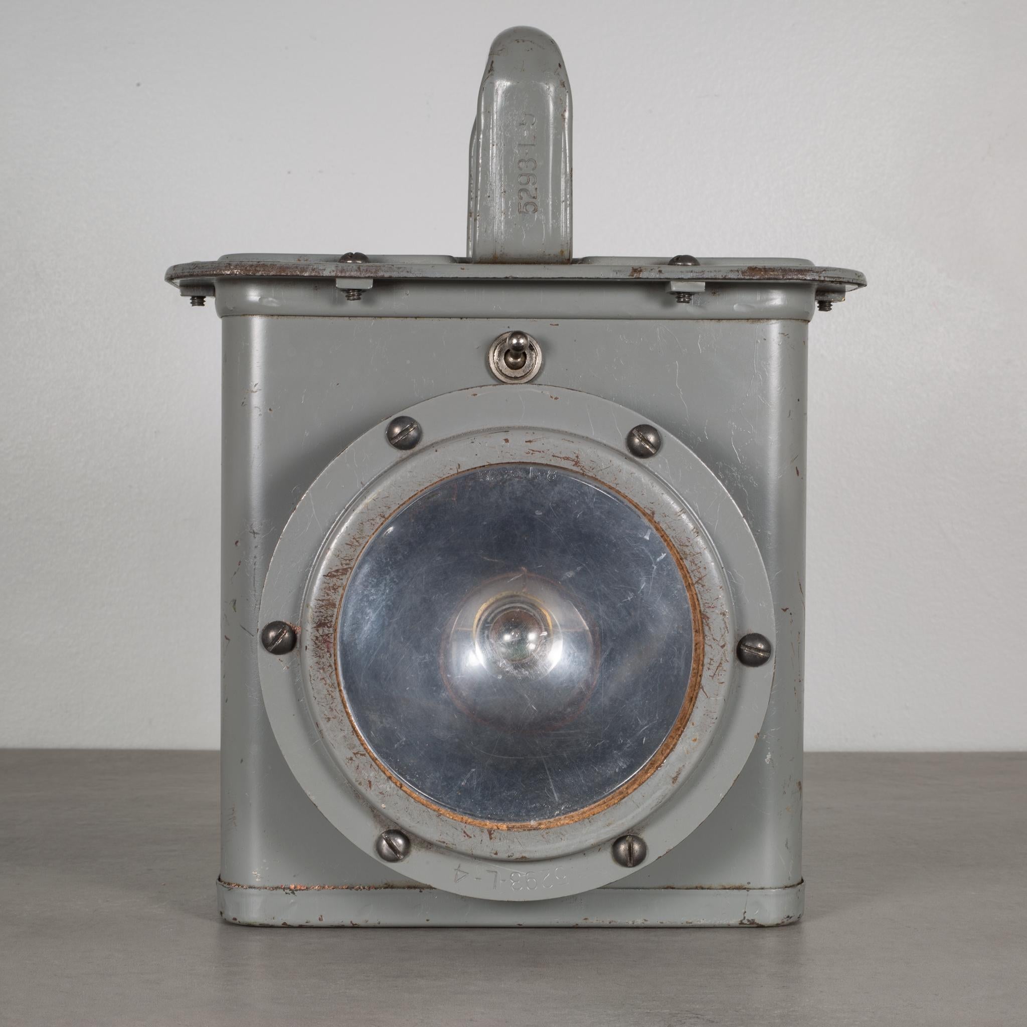 About:

This is an original U.S. Navy J-IS ship lantern light. The light has a switch in the front that turns it on. The light is in good working order. This piece has retained its original finish and has some minor blemishes. There are few