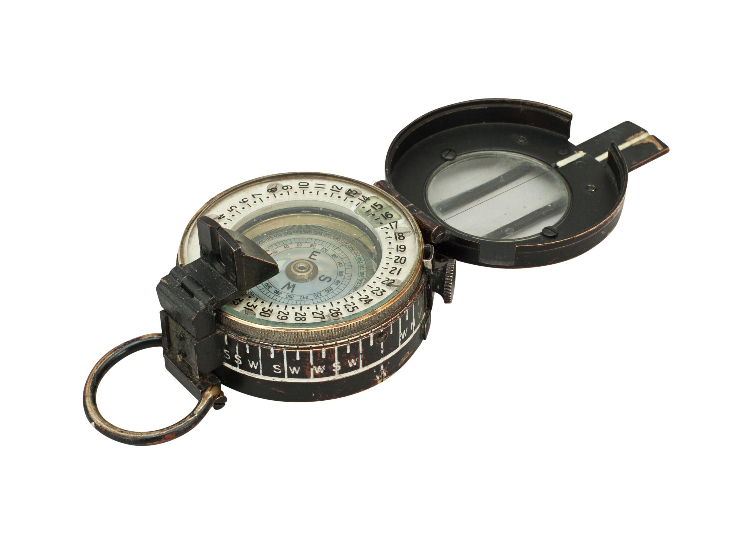 Canadian Kodak Company prismatic Mk.III compass
The World War II compass has a brass body and lid with original black finish, the glass lid having a sighting hairline and the lid lifting tab with aiming notch. There is a prism which allows you to