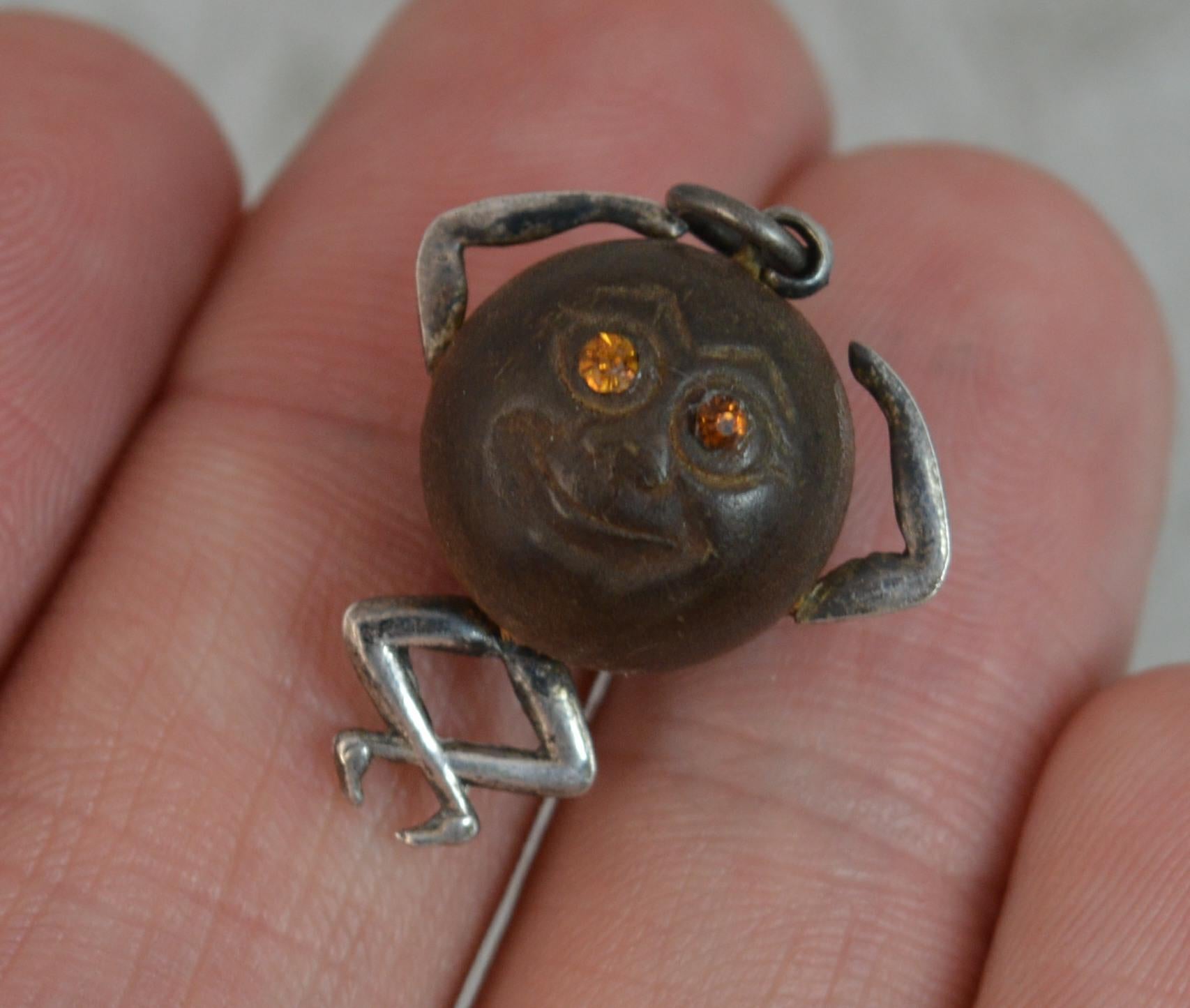 
A lovely Touch Wud World War One good luck charm. The little man designed with a circular wooden head with silver arms and legs and orange stone set eyes.


CONDITION ; Very good. Crisp design. Light wear only. Please view photographs.

WEIGHT ;