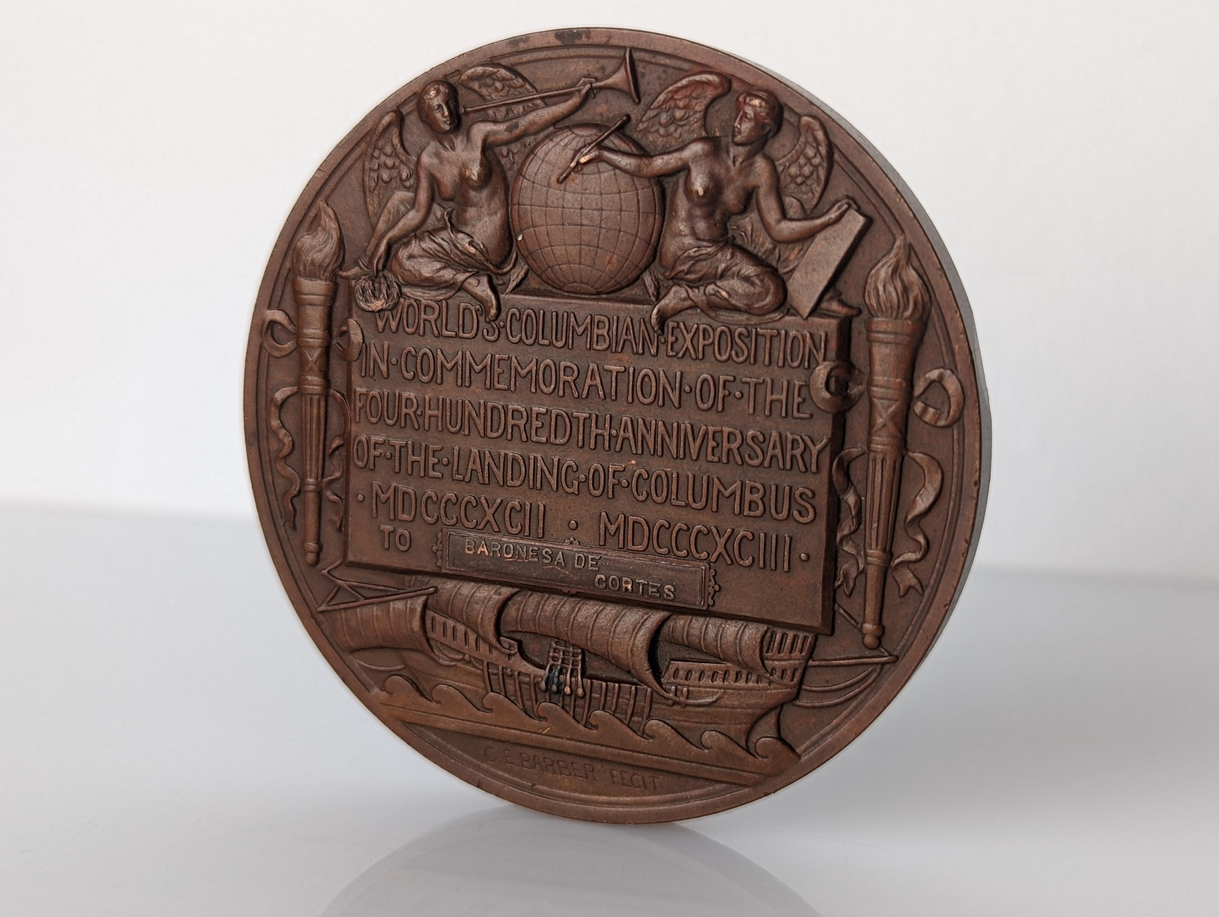 Bronze medal by Augustus Saint-Gaudes (front) and Charles F. Barber (back) for the official award at the World Columbian Exposition held in Chicago in 1893, delivered to Baroness de Cortes. Being the last and largest World Fair of the 19th century.
