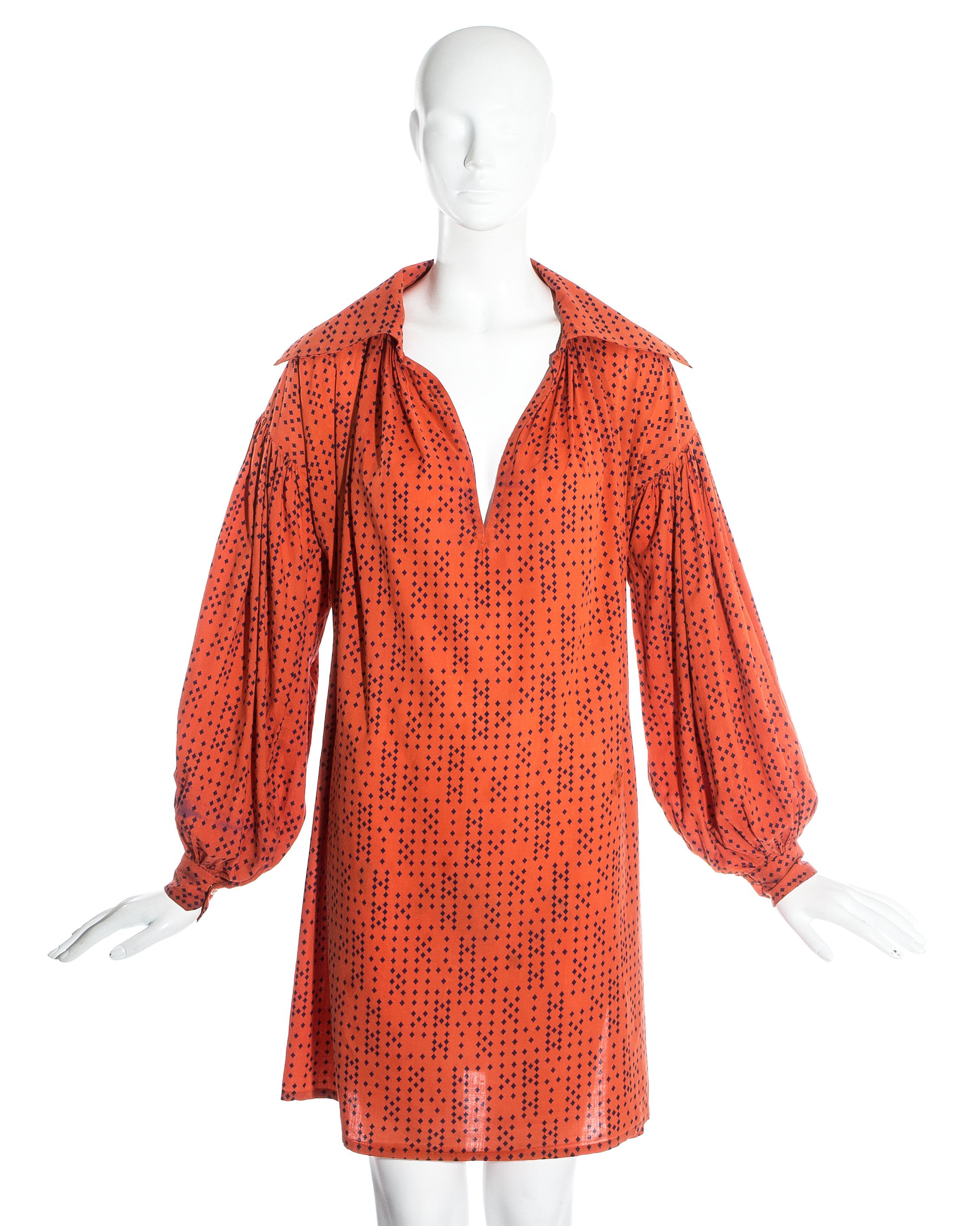 Worlds End by Vivienne Westwood and Malcolm McLaren; orange cotton oversized blouse.

'Pirates' Fall-Winter 1981