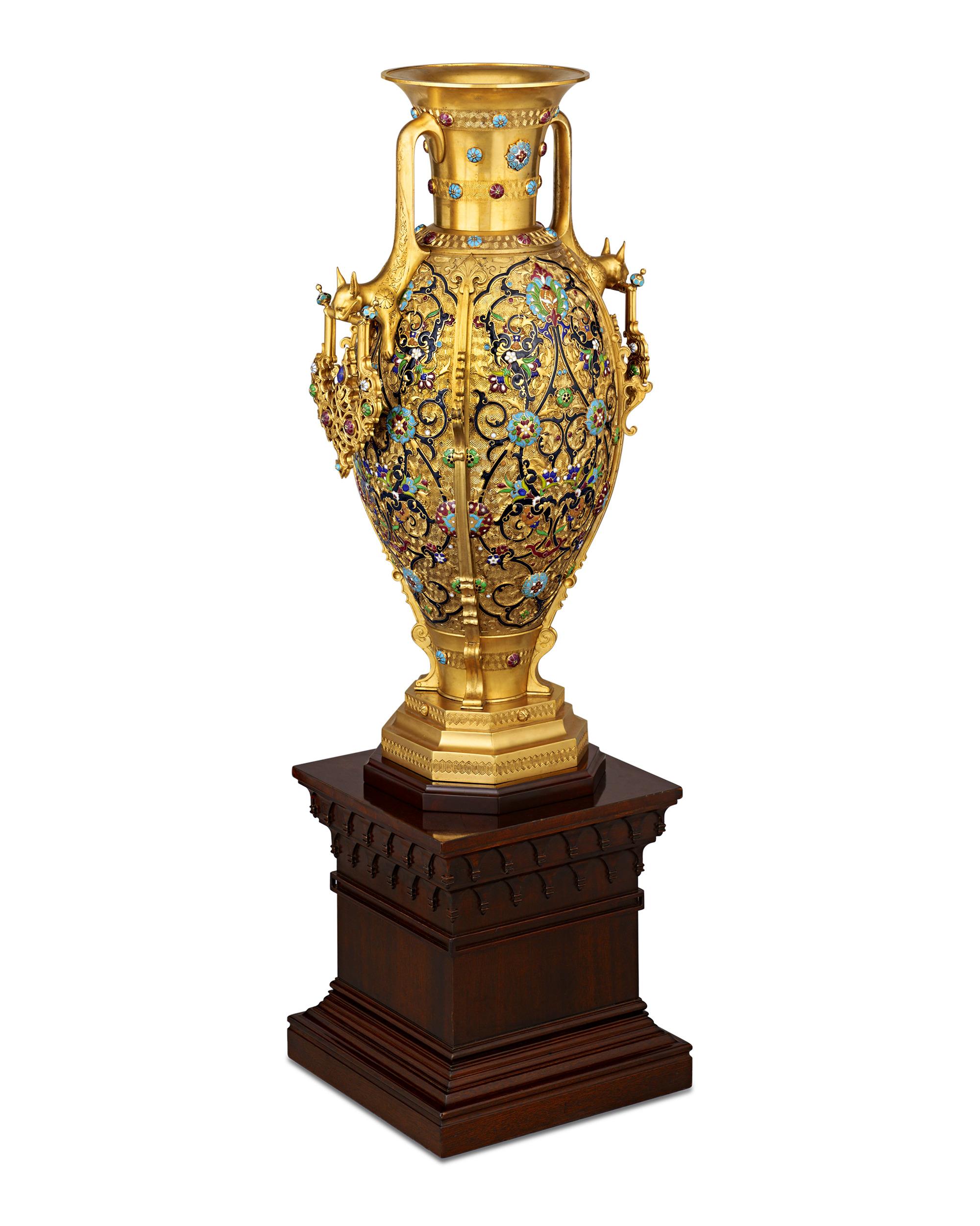 This monumental gilt-bronze and enamel vase marries the imaginative designs of Édouard Lièvre’s ‘le style japonais et chinois’ and the technical prowess of renowned bronzier Ferdinand Barbedienne. The urn features elaborate decoration and two