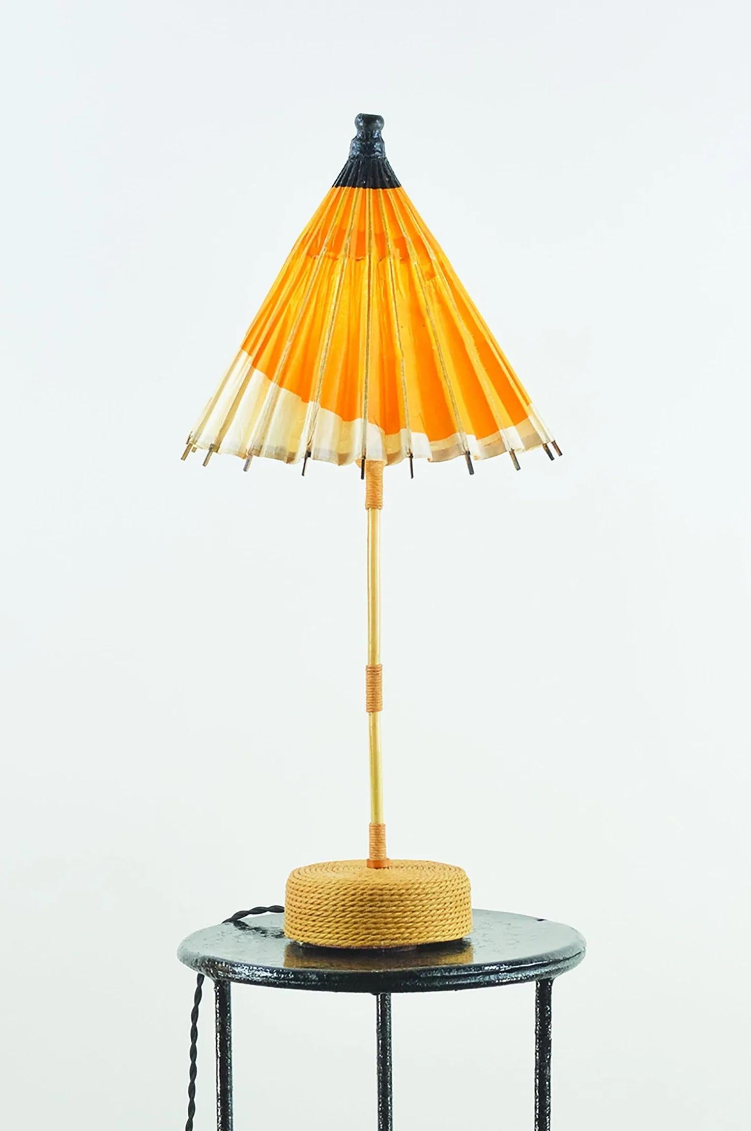 The World’s Fair Collection is a family of fixtures handmade from sustainably sourced materials and upcycled antique paper parasols given to visitors at the 20th century’s most illustrious cultural expo.

Model No. 004A features a faded orange