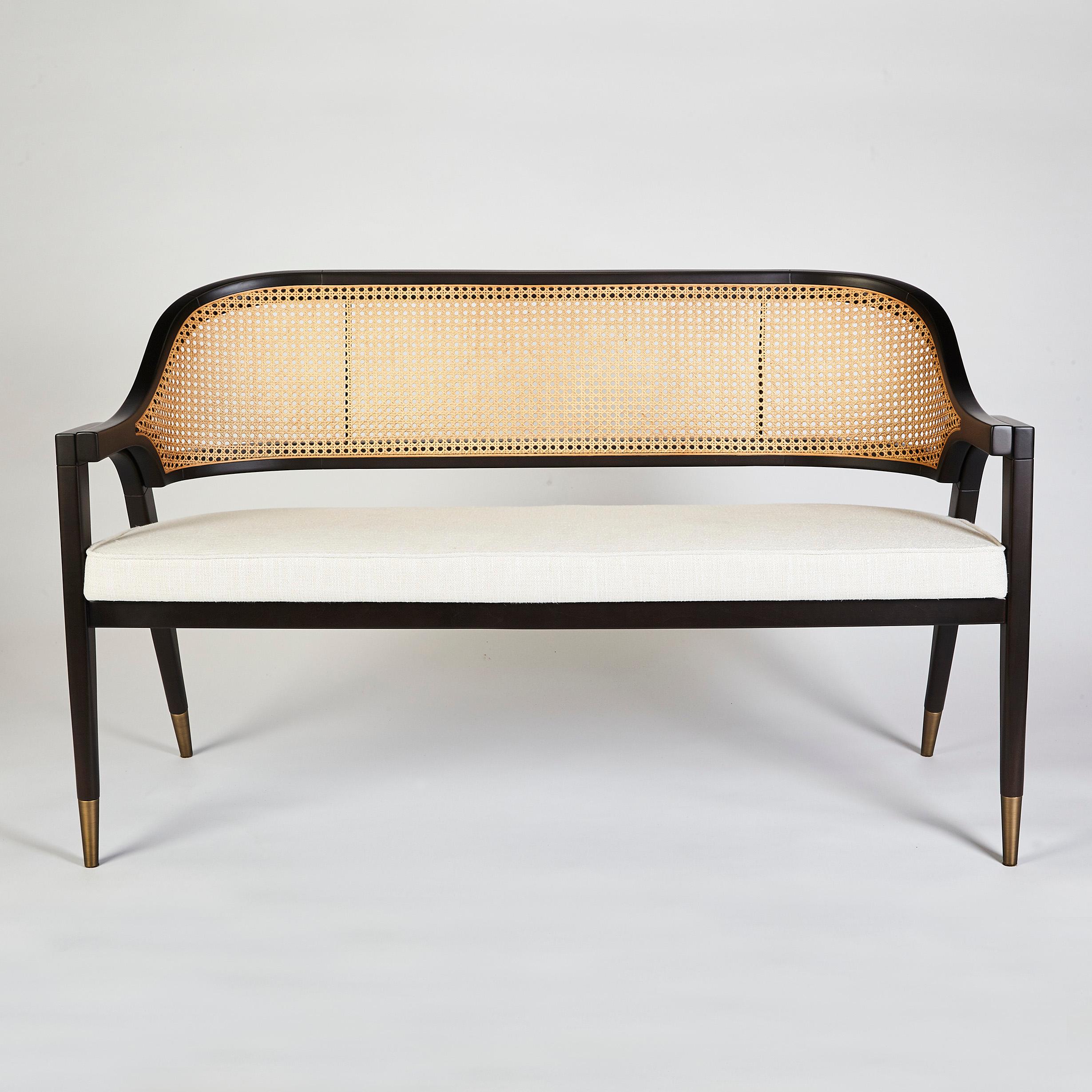 Wormley Bench by DUISTT 
Dimensions: W 132 x D 57 x H 81 cm
Materials: Duistt Fabric, Darkened Sikomoro, Natural Cane and Brass details
Other finishes are available. Please contact us for any request.

Wormley bench pays a tribute to American design
