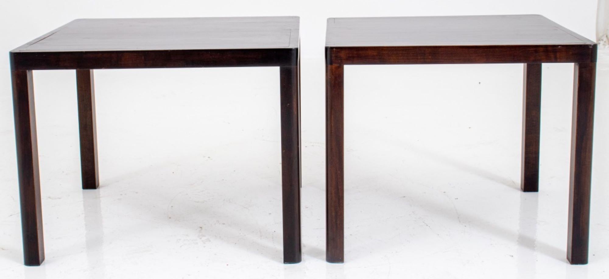 Modernist square mahogany lamp tables, a pair, in the manner of Wormley for Dunbar in a slender Parsons form. Measures: 18