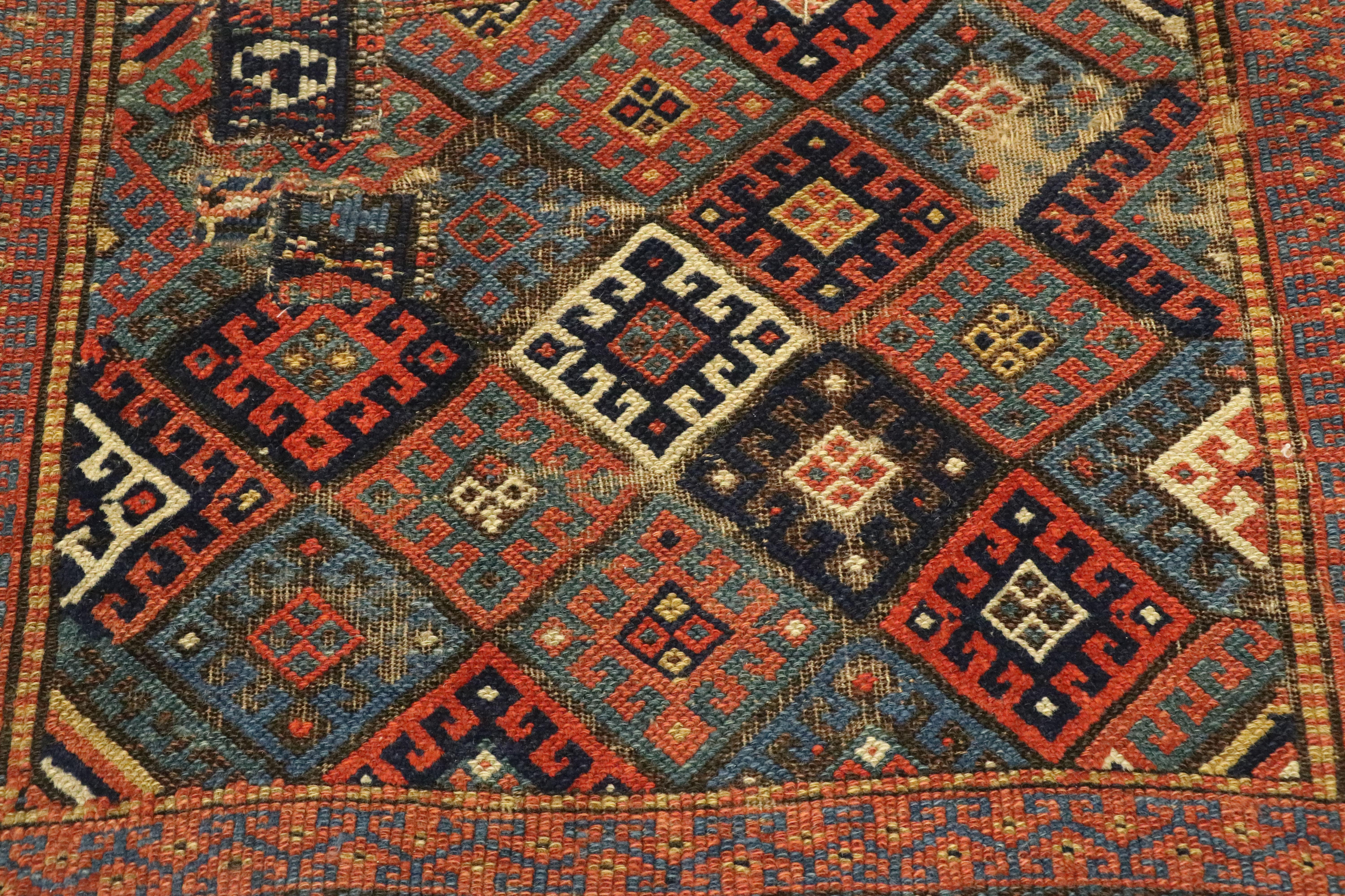 Worn Antique Caucasian Kazak Rug with Tribal Style In Distressed Condition For Sale In Dallas, TX