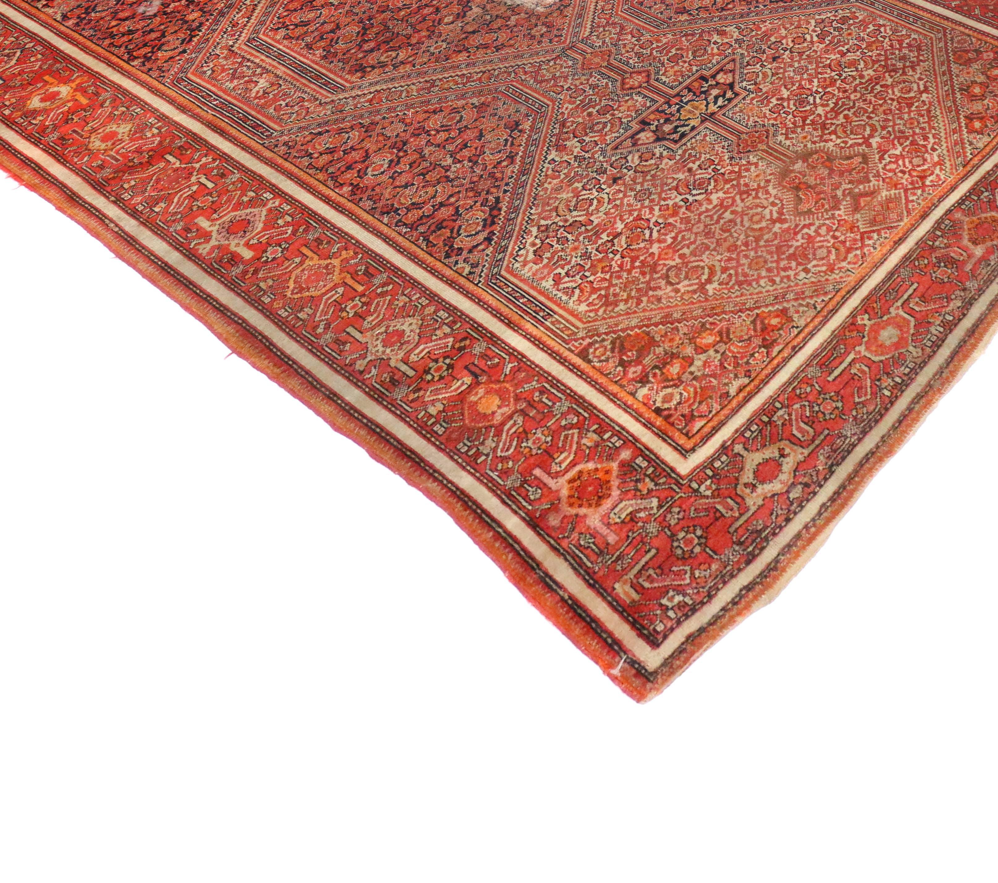 73287, an antique Persian Malayer rug. This hand-knotted wool antique Persian Malayer rug features a central geometric medallion flanked by two smaller versions to each side, rendered in red, orange pumpkin, midnight navy blue and beige. Medallions