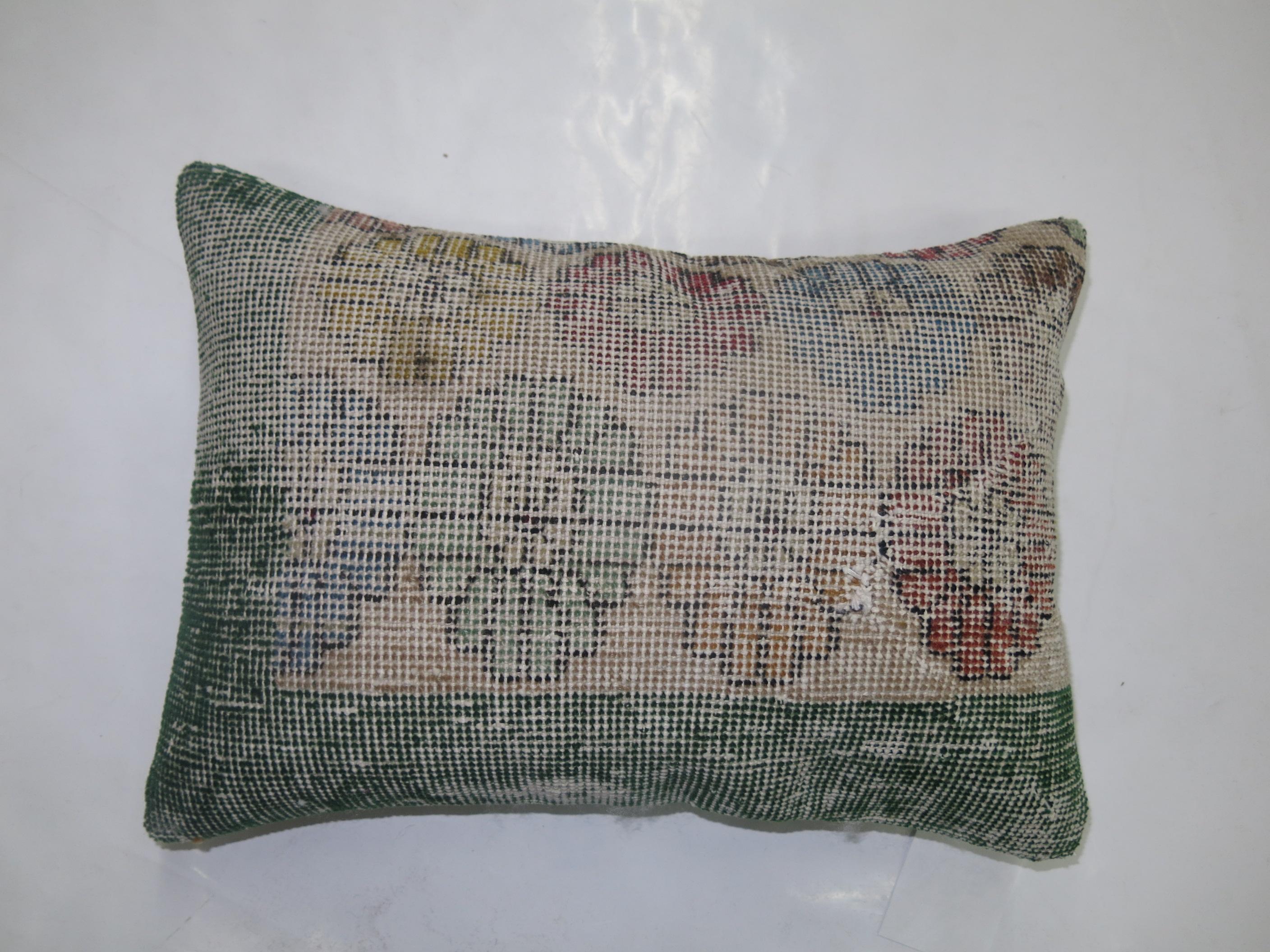 Pillow made from a Turkish Deco rug 

Measures: 14'' x 19''.