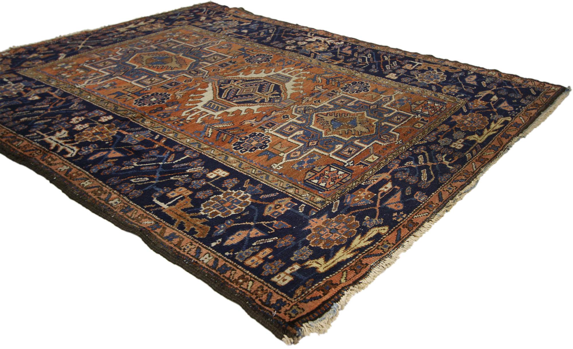 72988 Worn-In Distressed Antique Persian Karaja Heriz Rug with Rustic Style. This hand-knotted wool distressed antique Persian Karaja Heriz rug with Mid-Century Modern style features a latch-hook amulet flanked by two square cruciform medallions