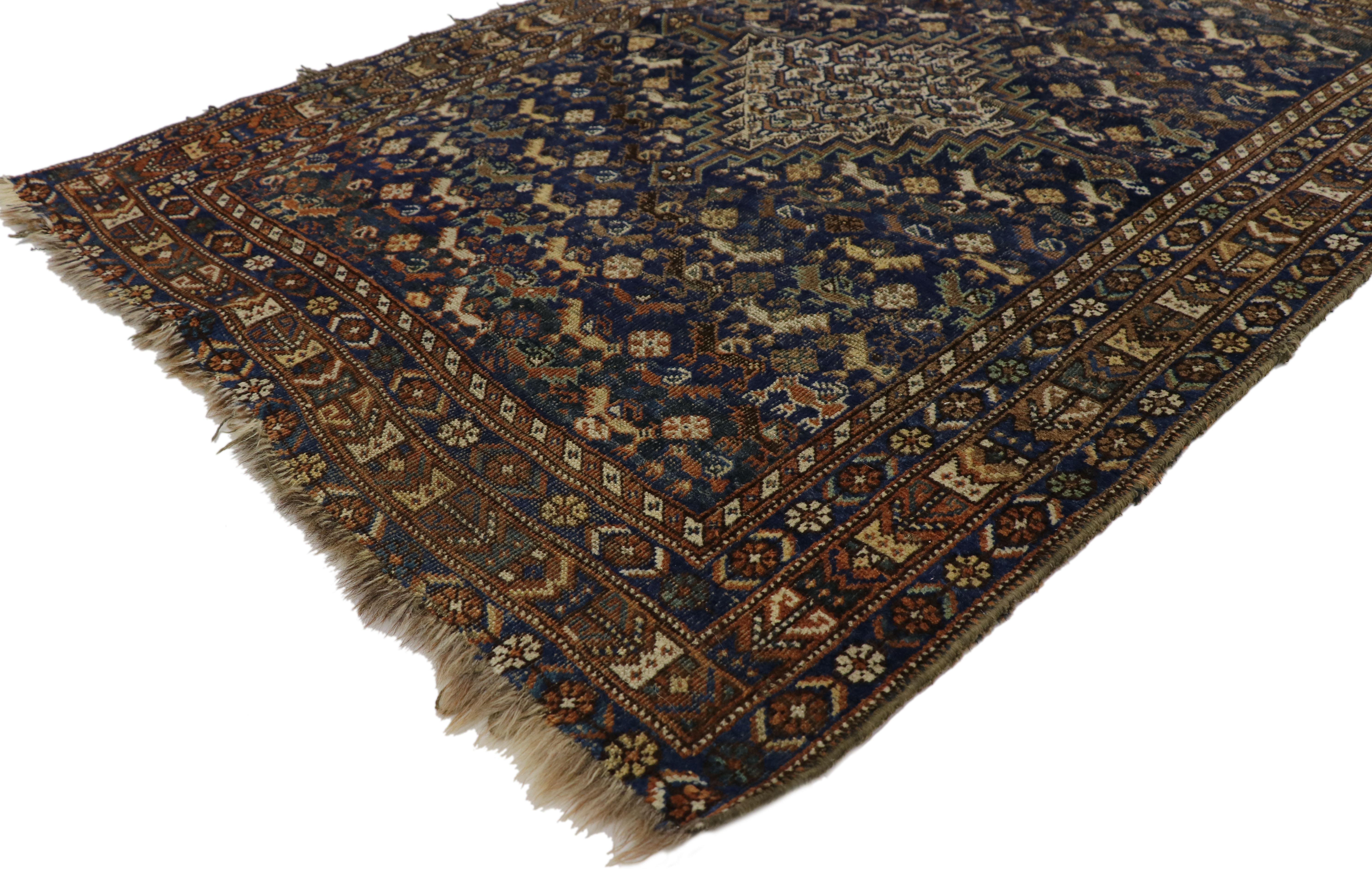 77331, worn-in distressed antique Persian Shiraz accent rug with rustic Adirondack Lodge style. This hand knotted wool distressed antique Persian Shiraz rug with rustic Adirondack style features a latch-hook diamond lozenge amulet surround by an