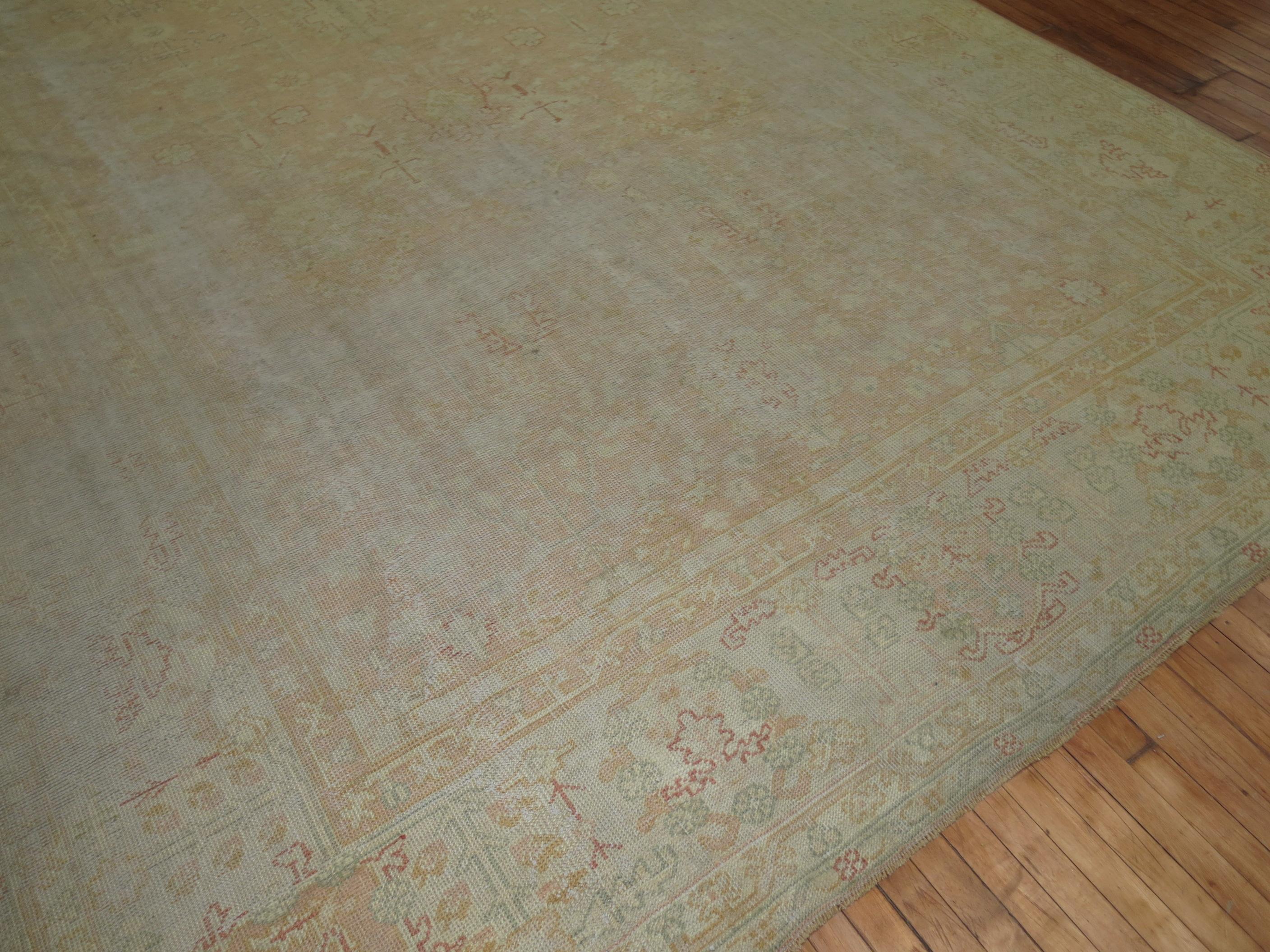Hand-Woven Worn Pale Peach Large Antique Turkish Oushak Rug For Sale