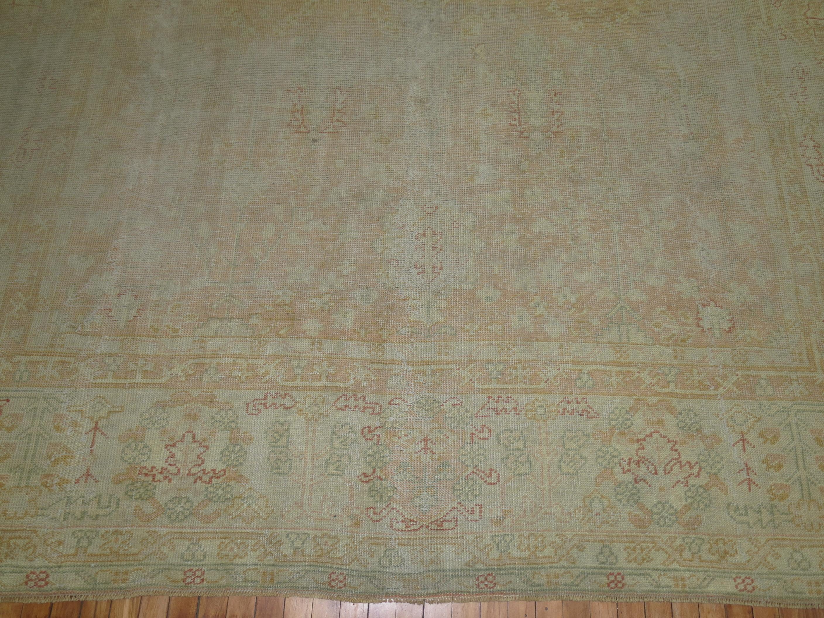 Worn Pale Peach Large Antique Turkish Oushak Rug In Fair Condition For Sale In New York, NY