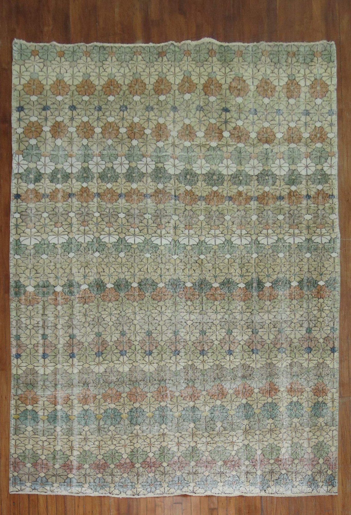 A worn circa mid-20th century rustic color Turkish Deco rug

Measures: 6'11'' x 10'4”.