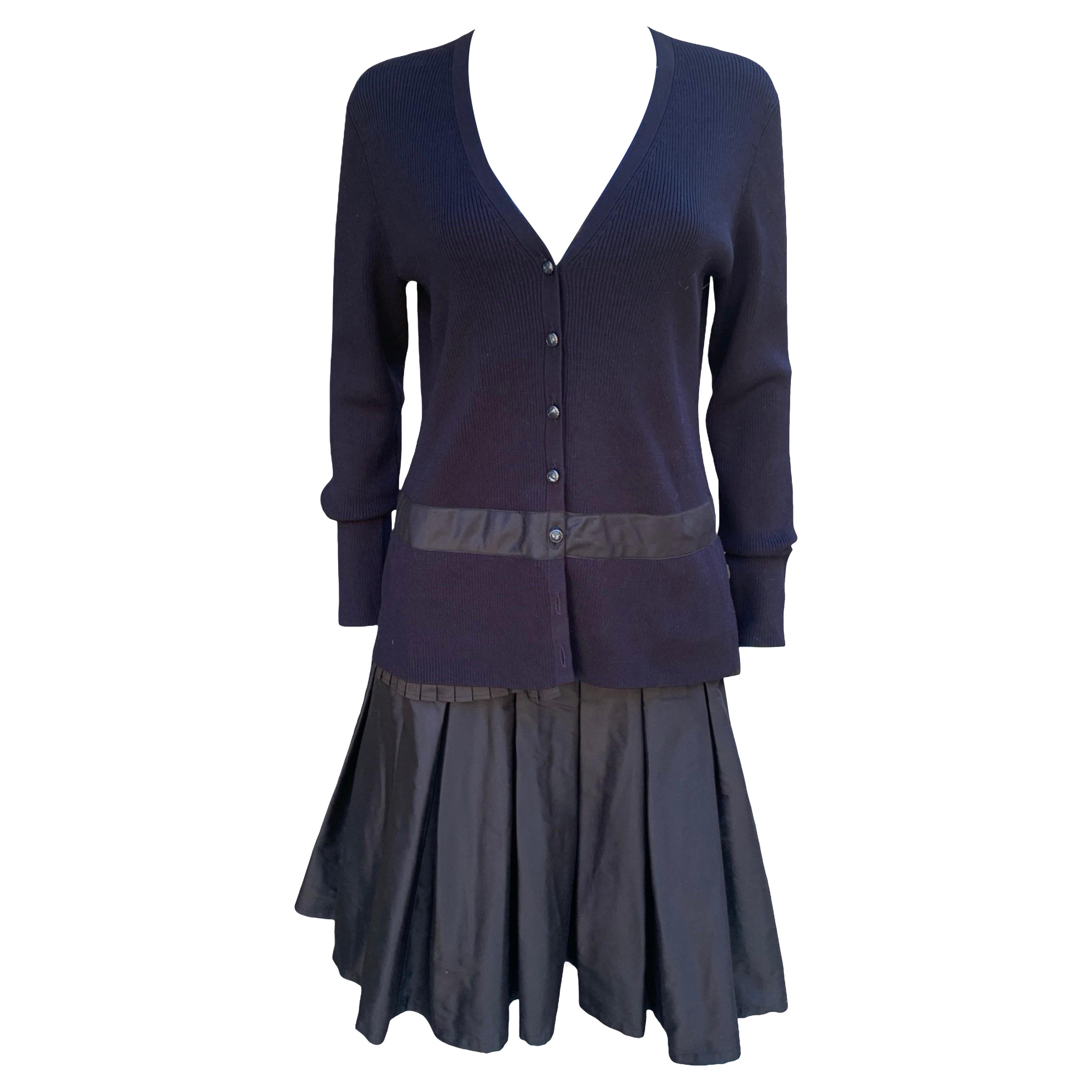 The details on this vintage Worth New York 2 piece cardigan and skirt are so charming. The silk knot cardigan has beautiful enamel buttons, a deep V to wear with or without a tank/blouse underneath. A detailed box pleat around the hem of the