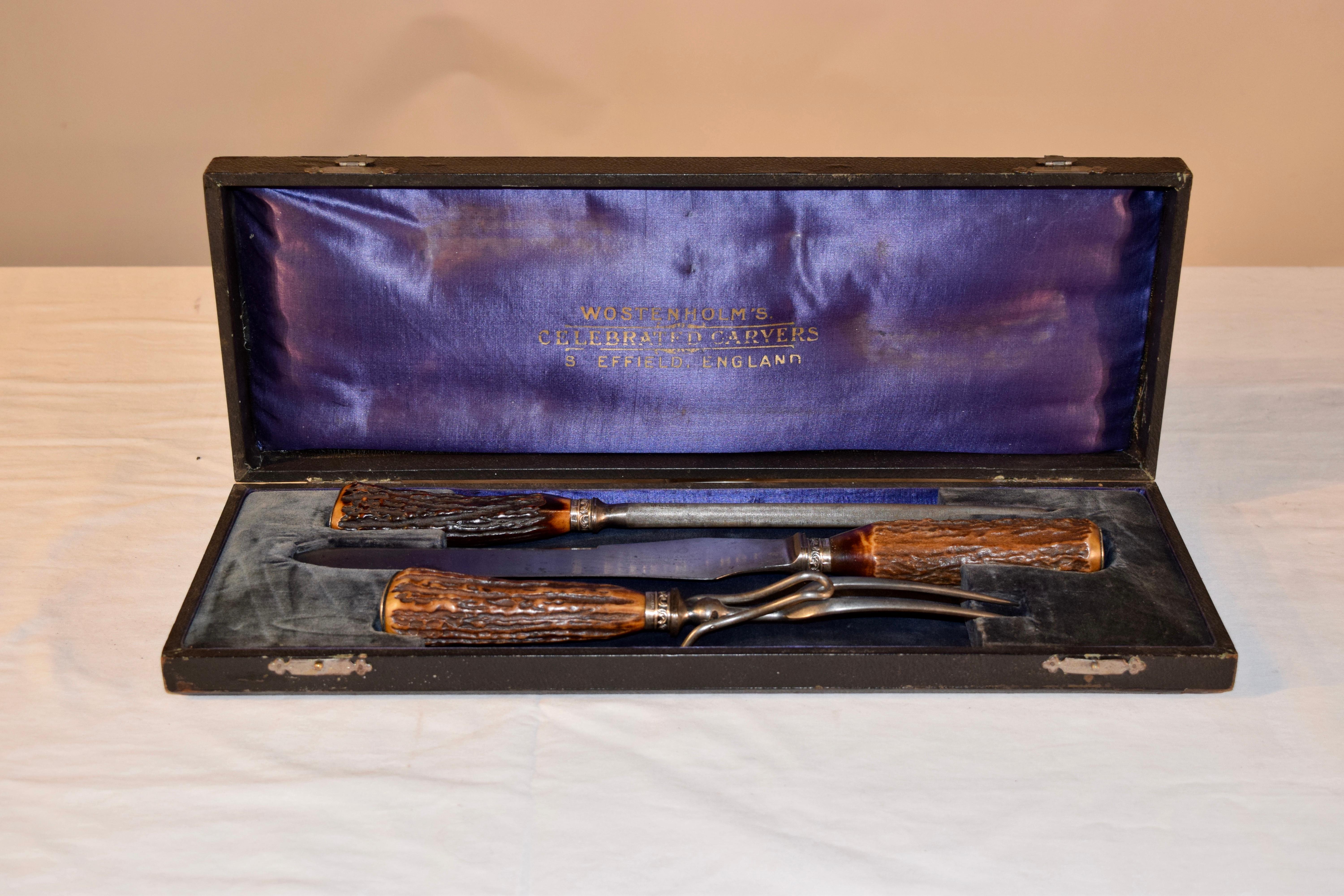 English carving set with lovely antler handles made by Wostenholm of Sheffield. Wostenholm was and still is know to be some of the best quality knives you can buy, and are very collectable. The original case is a wonderful find as well, lined in