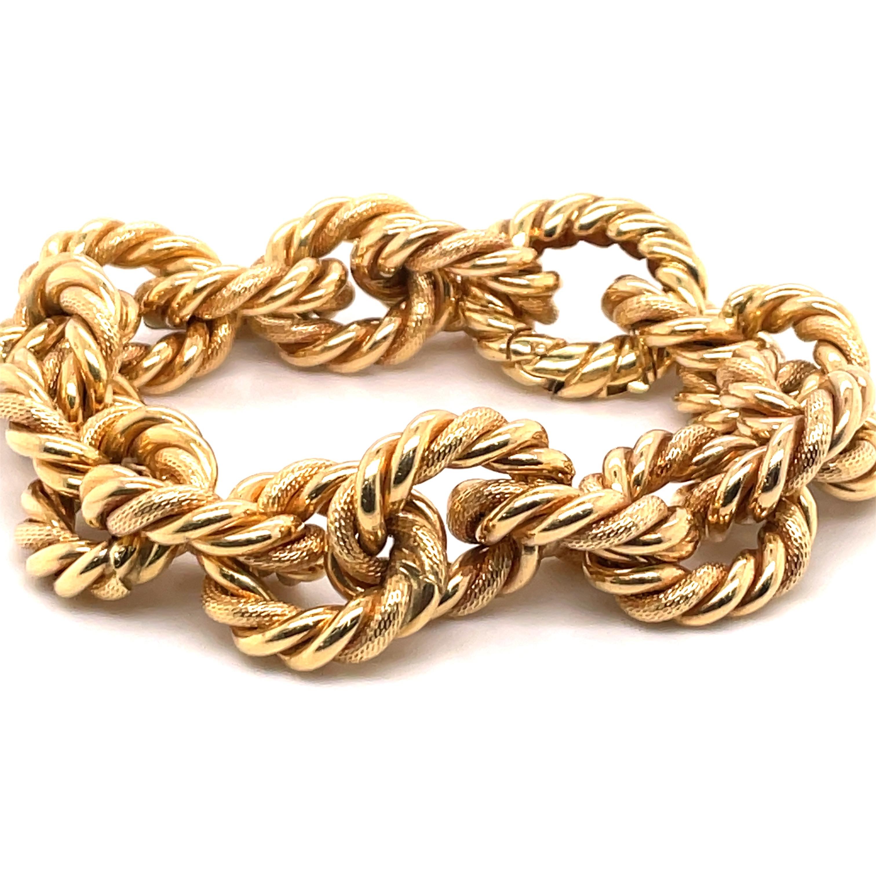 18 Karat Yellow gold bracelet featuring 18 woven & polished links weighing 72.9 grams. 
Link 0.75 inches long
Very fashionable and great for stacking.
Email for more gold bracelets. 

