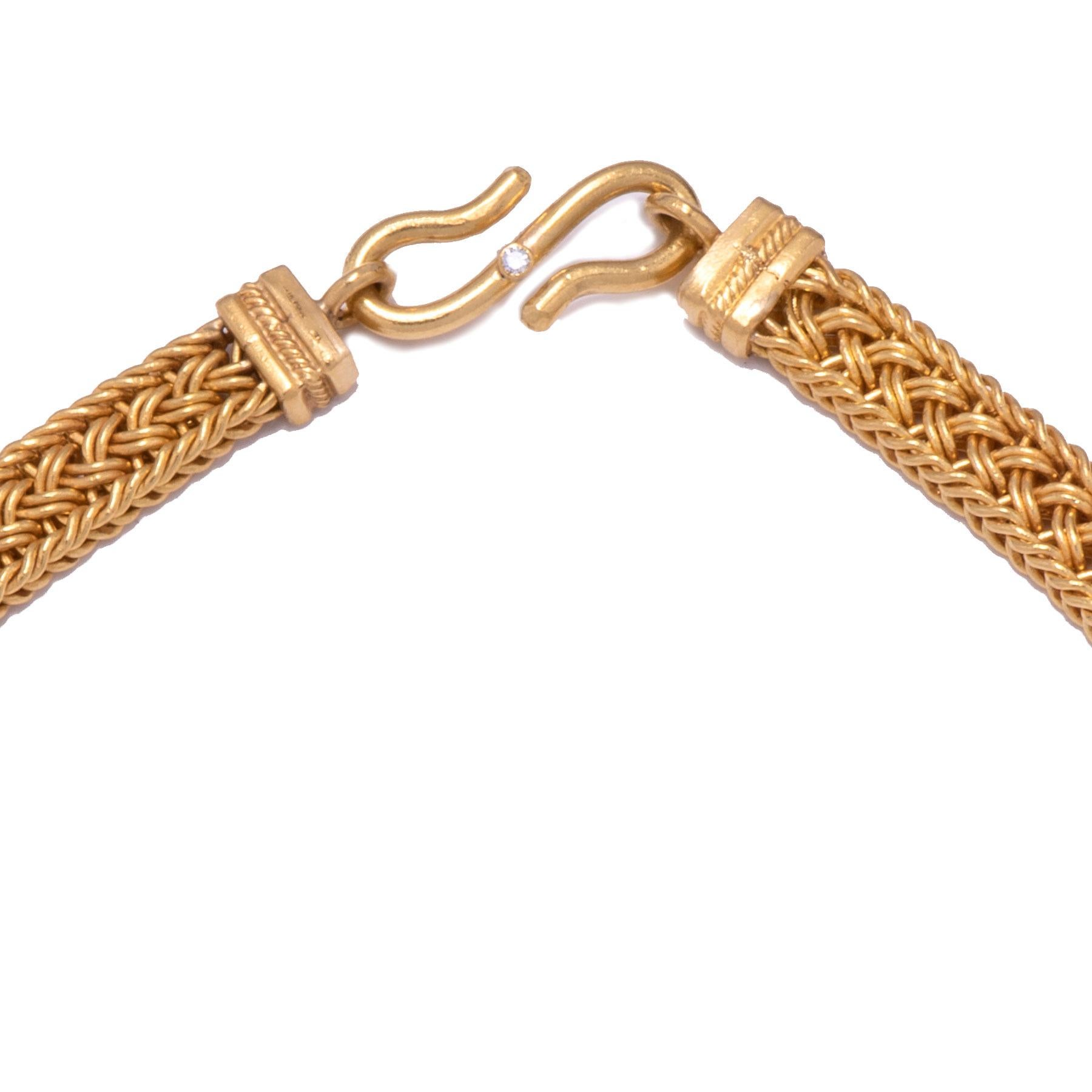 Handwoven of 22k gold by Keith Berge, this necklace is fitted with a hand crafted S clasp in 22k gold set with a white diamond. At 17